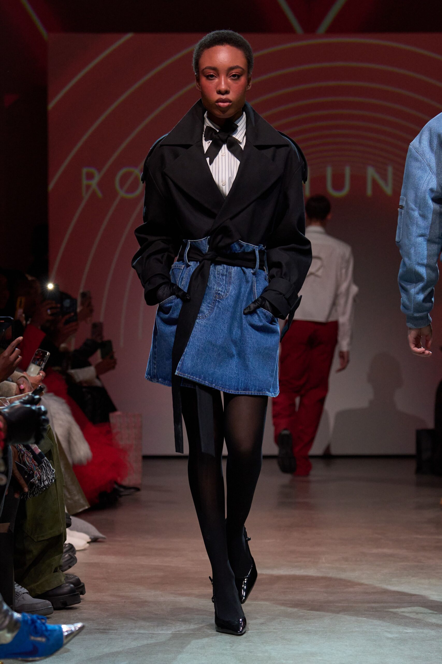 black coat with blue denim skirt