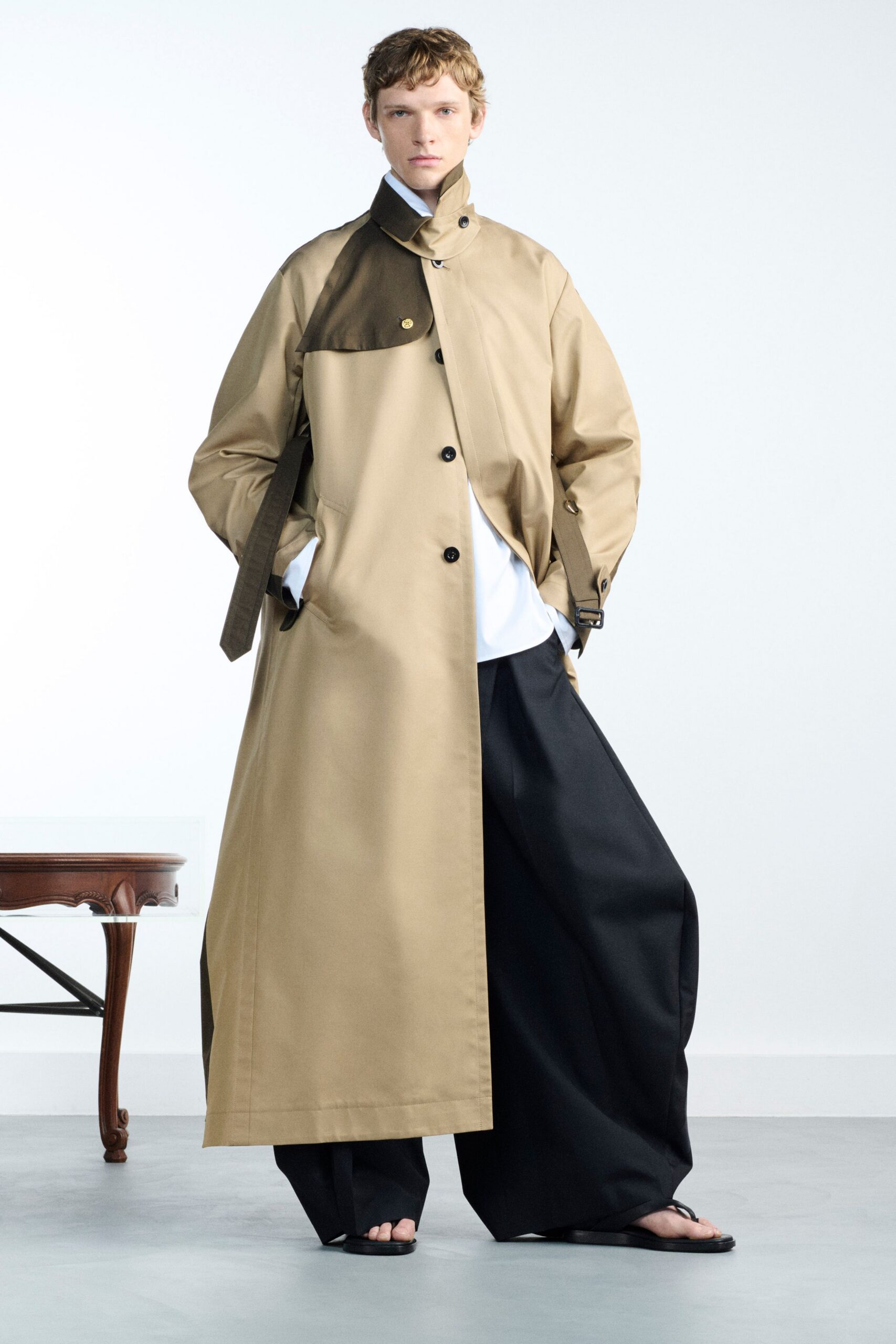 beige coat with black pants
