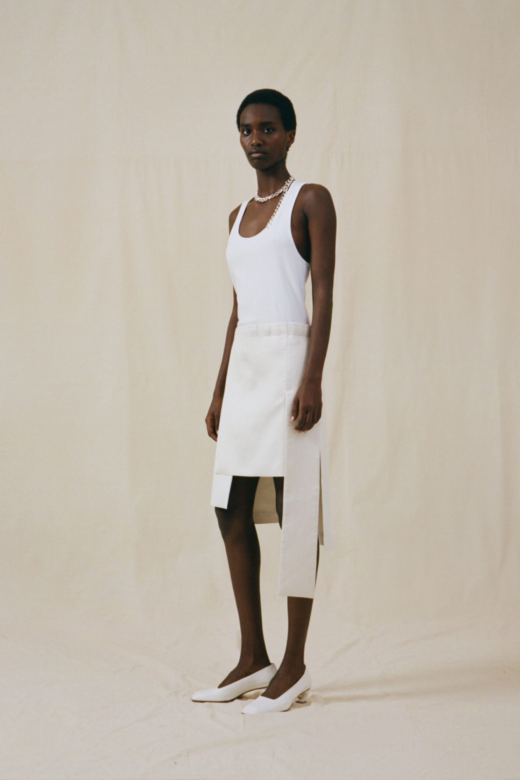 white tank-top and skirt