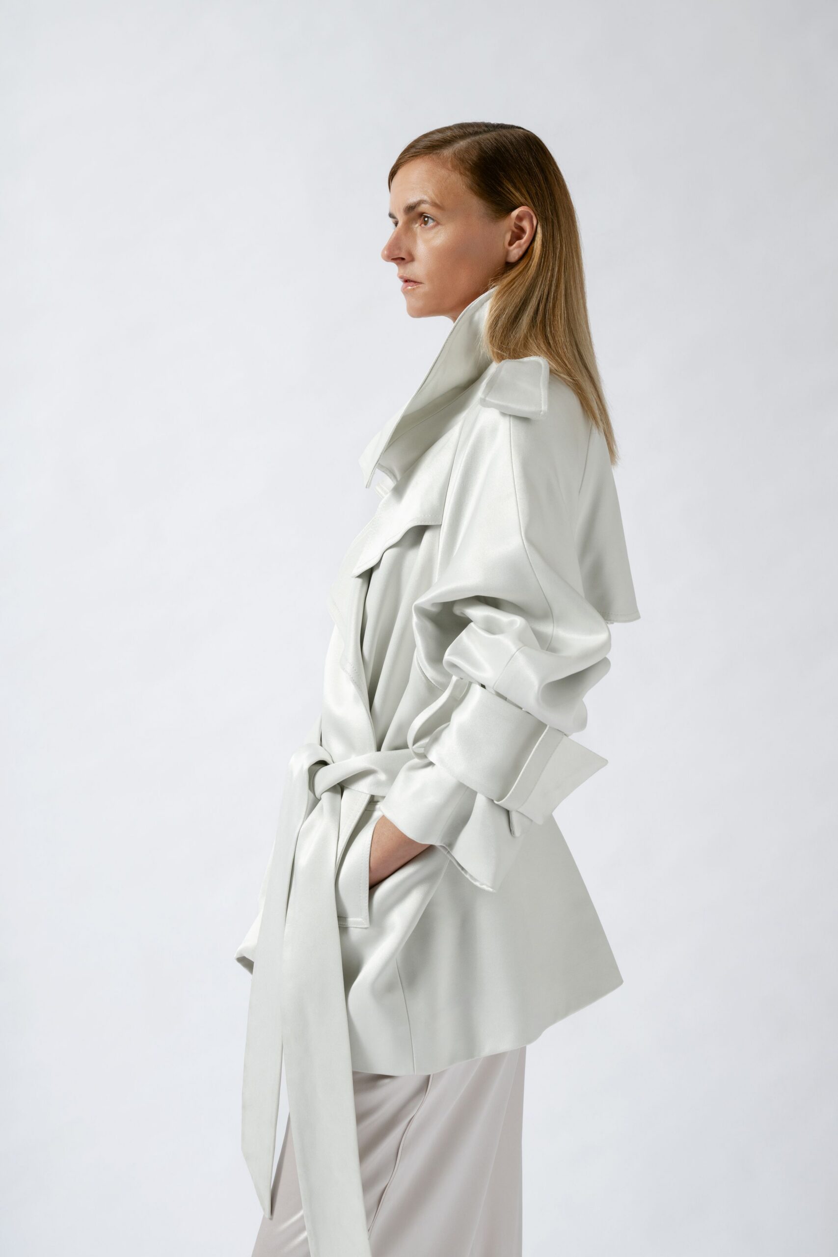 white silk relaxed jacket and beige pants