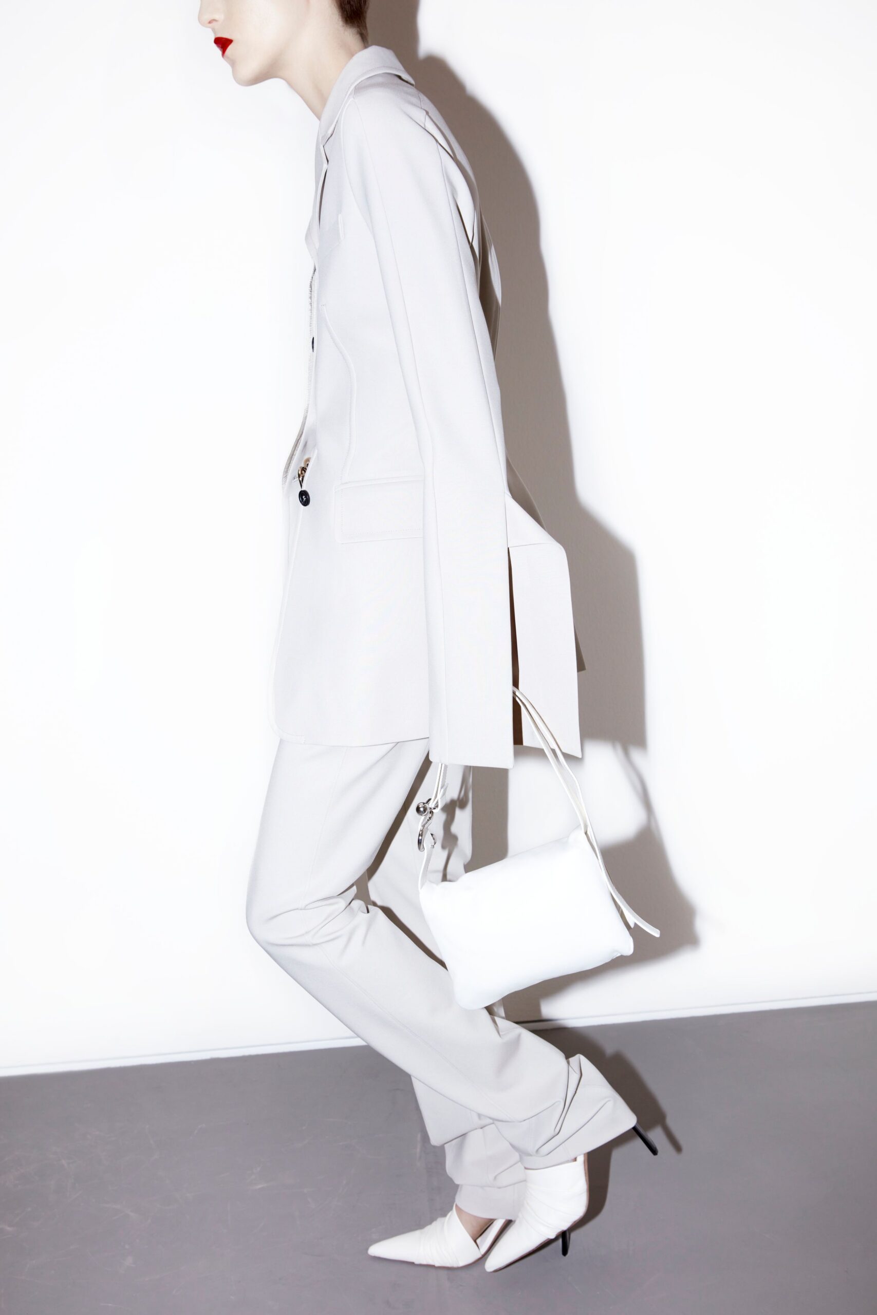 white tailored suit with pointed shoes
