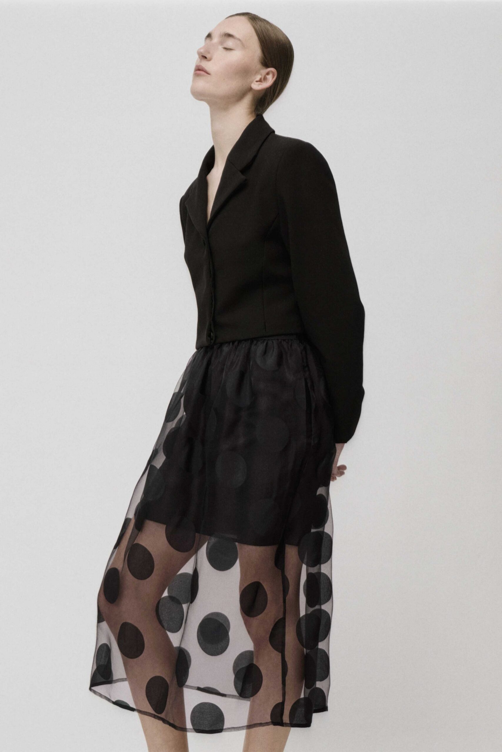 black blazer and polka-dot skirt