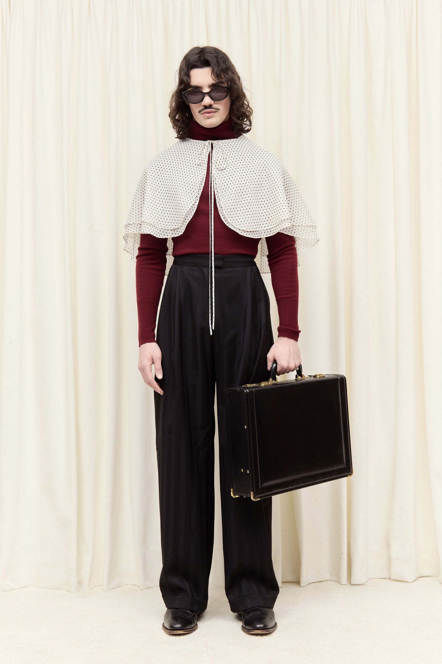 red fitted top with white cape