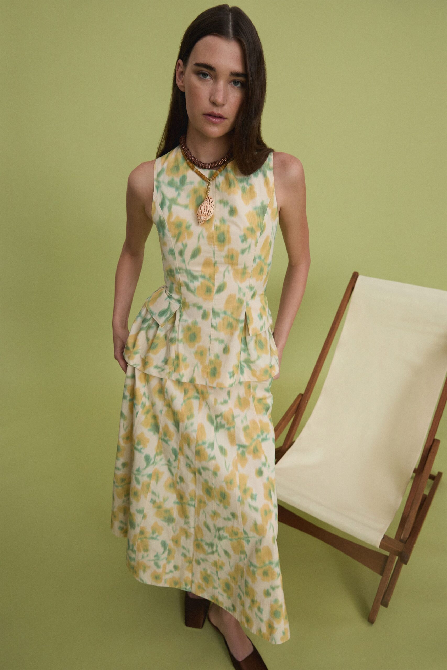 yellow cotton sleeveless high-neck fitted pleated midi dress