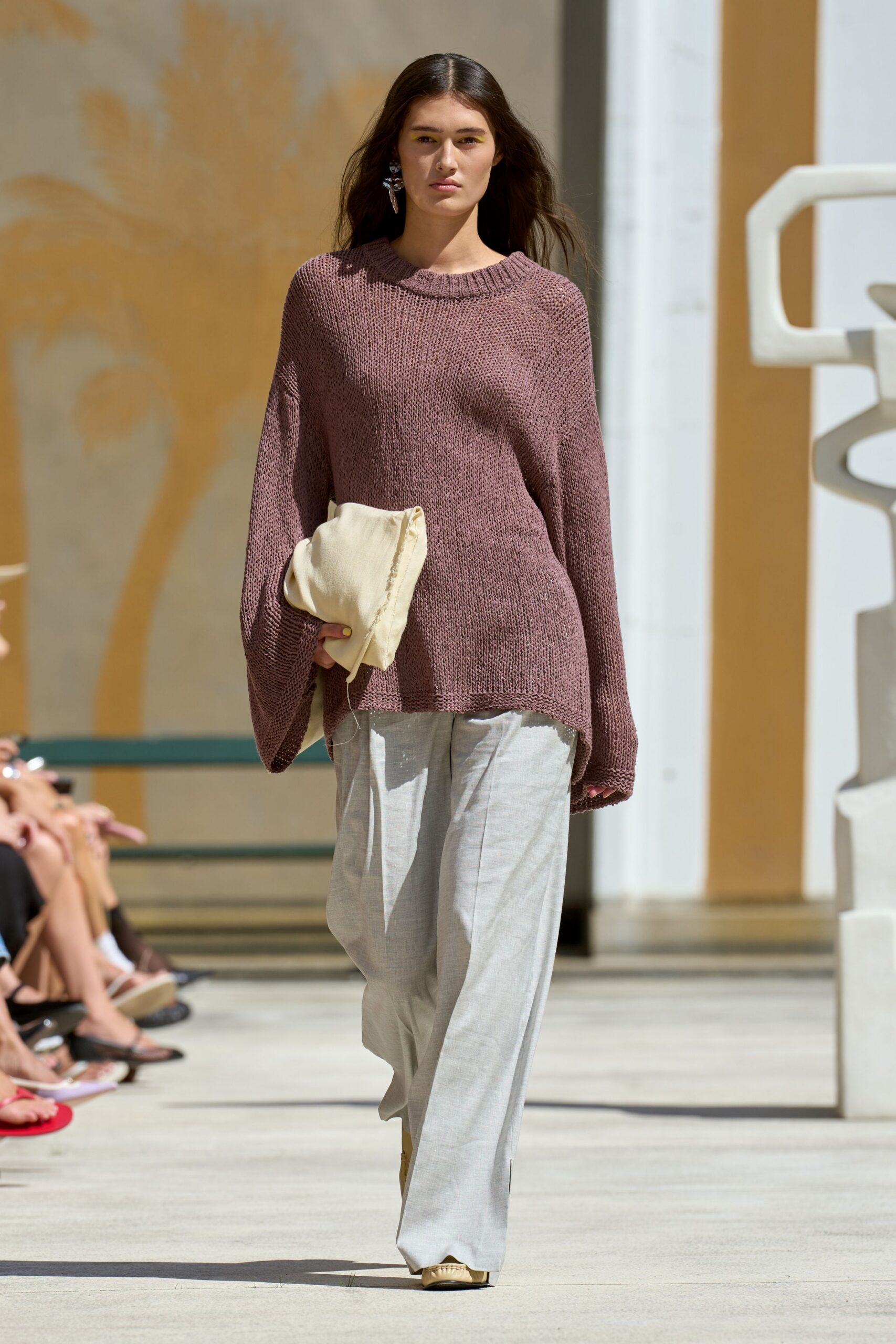 brown relaxed sweater with gray pants