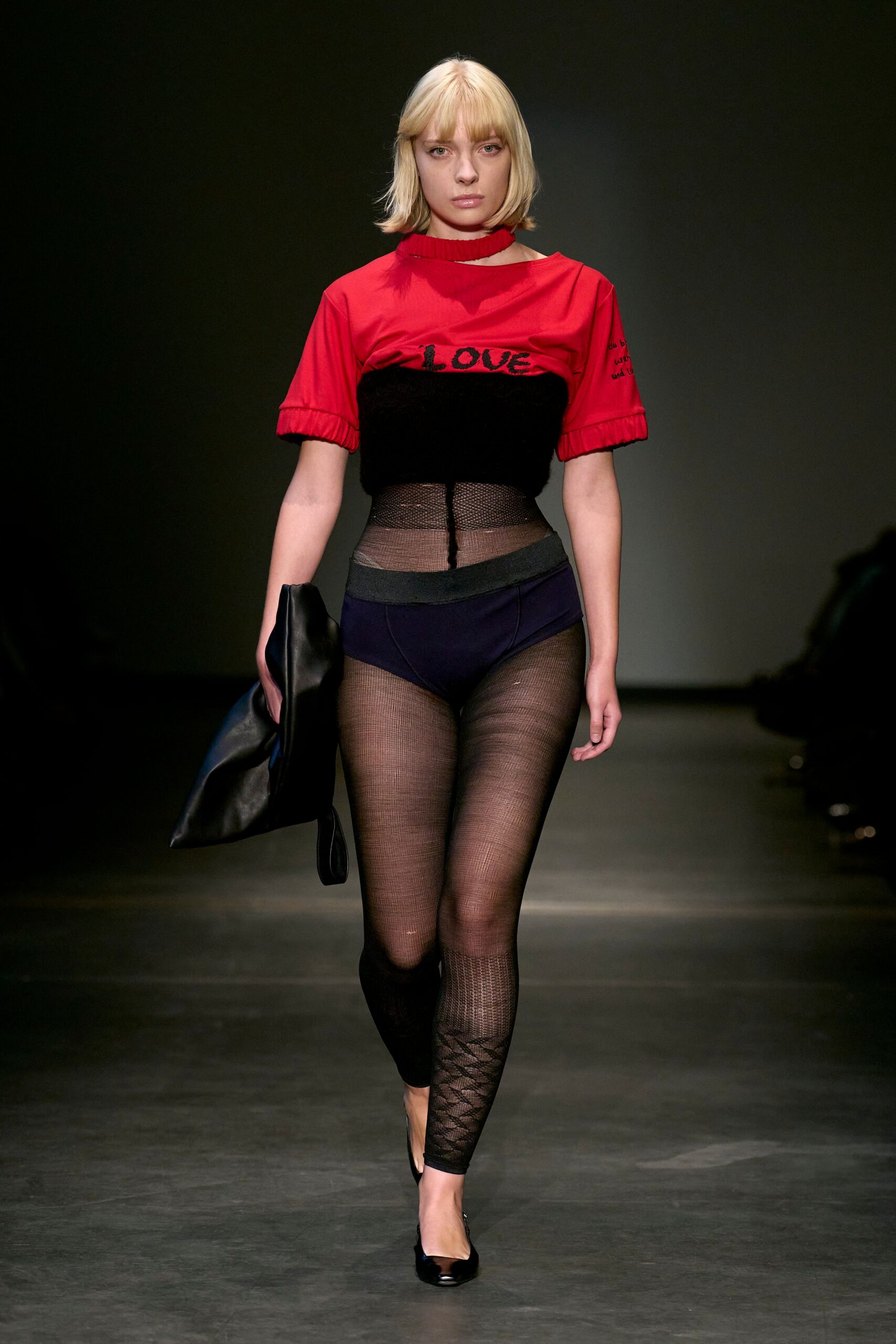 red fitted top with black leggings