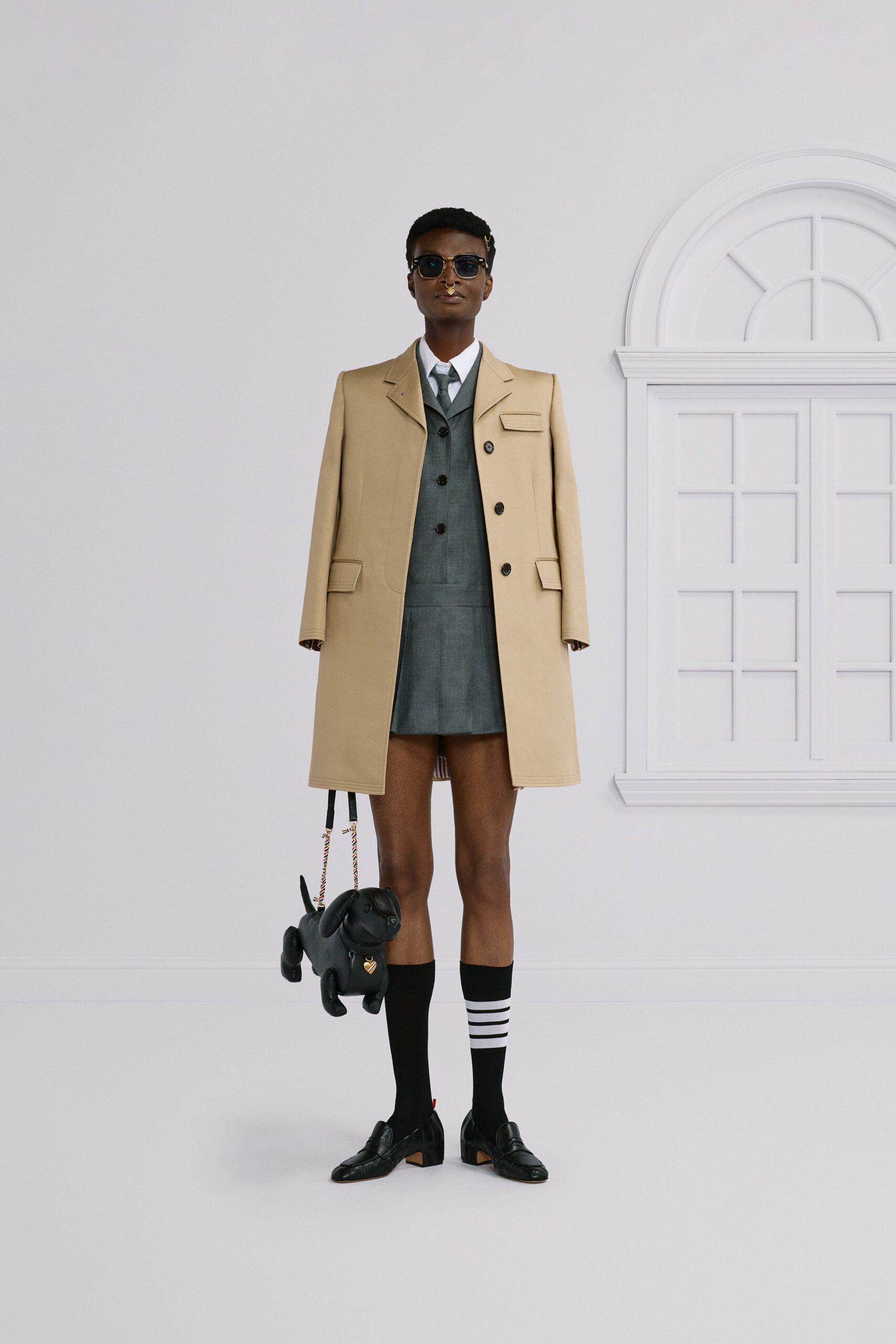 beige coat gray suit black shoes