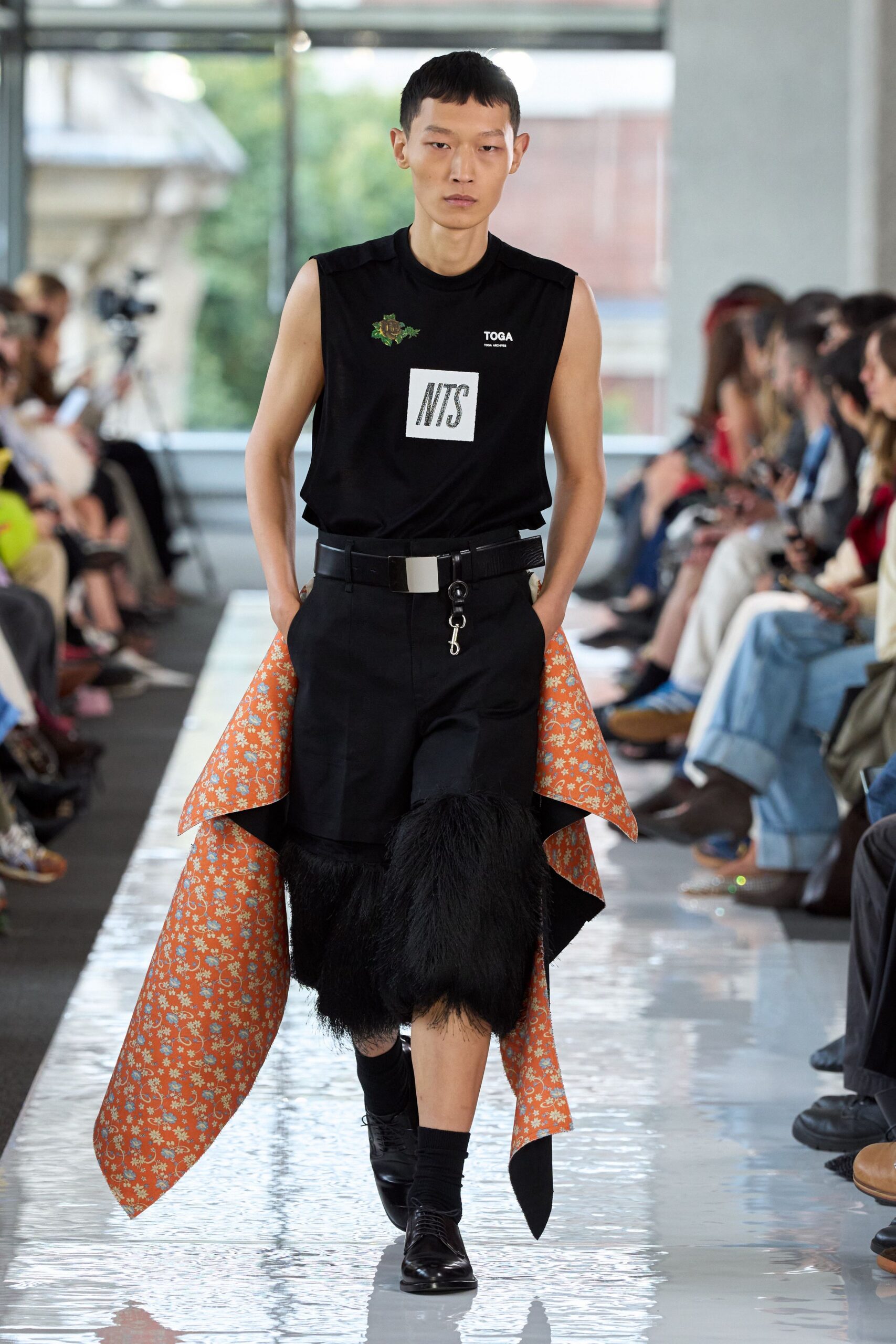 black fitted top with orange cape