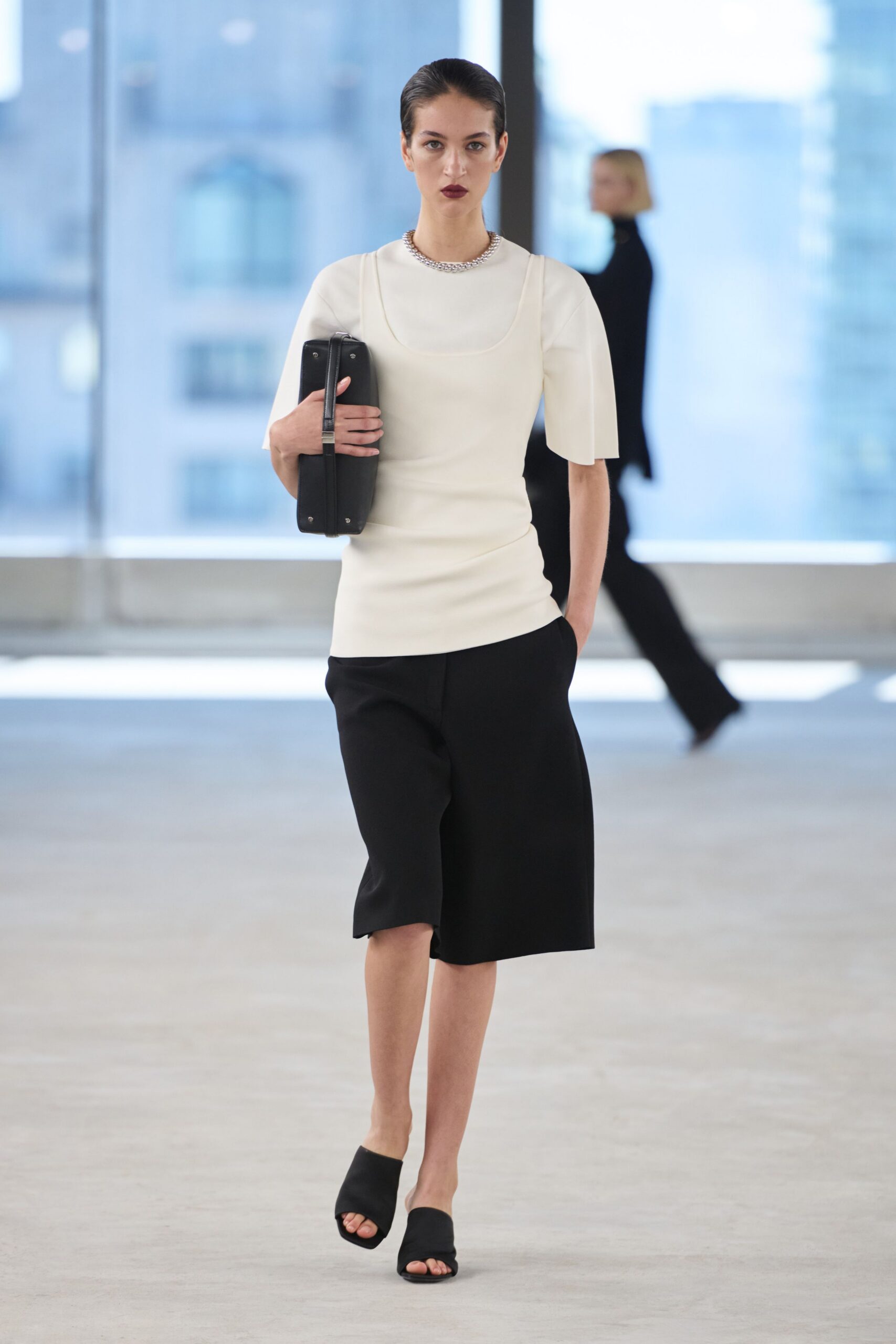 white fitted top with black skirt