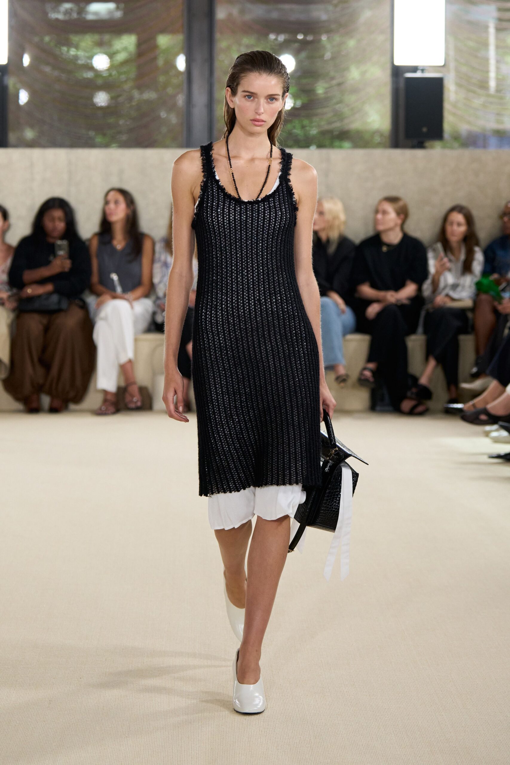 black mini dress with white underlayer