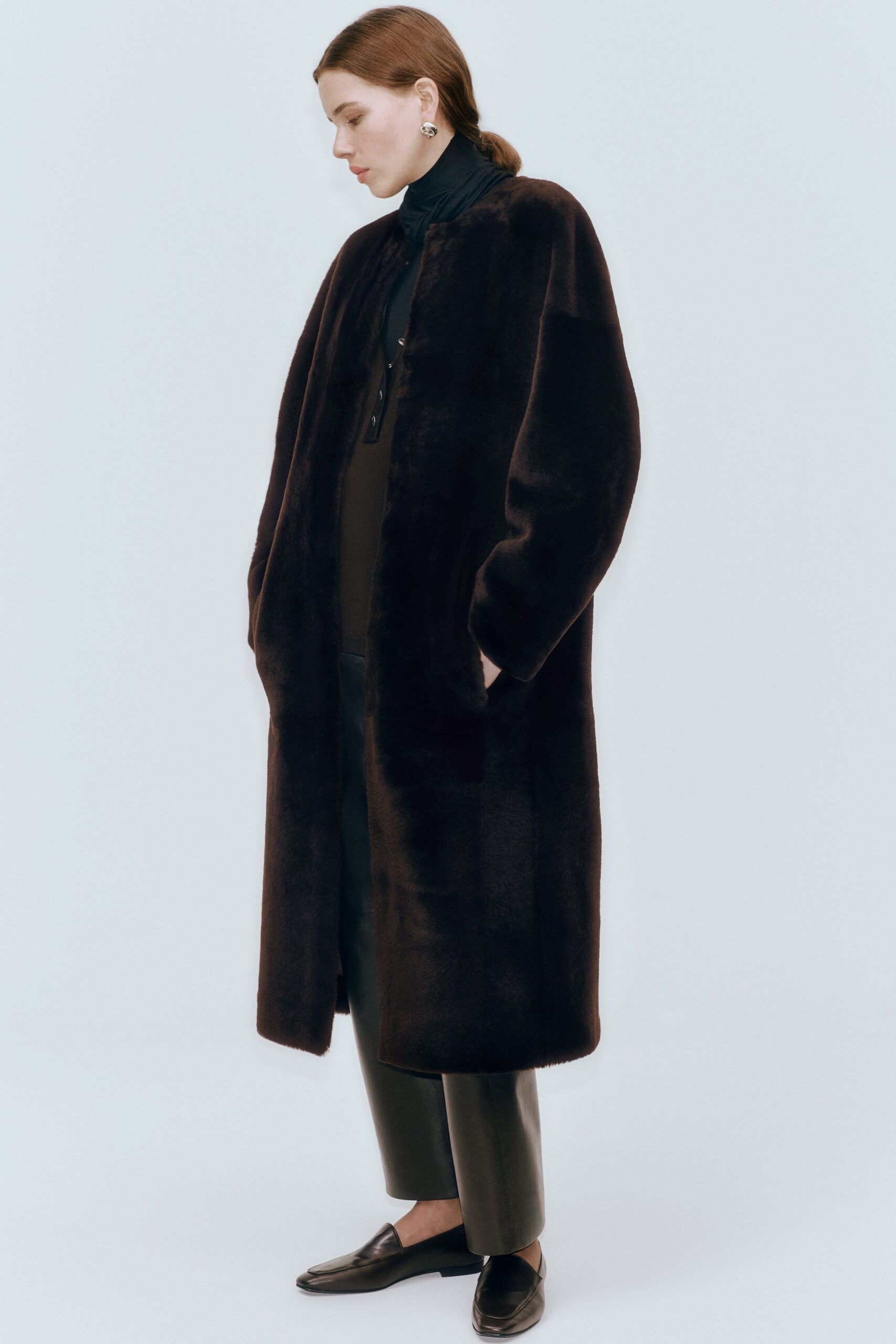 brown faux-fur coat with black top