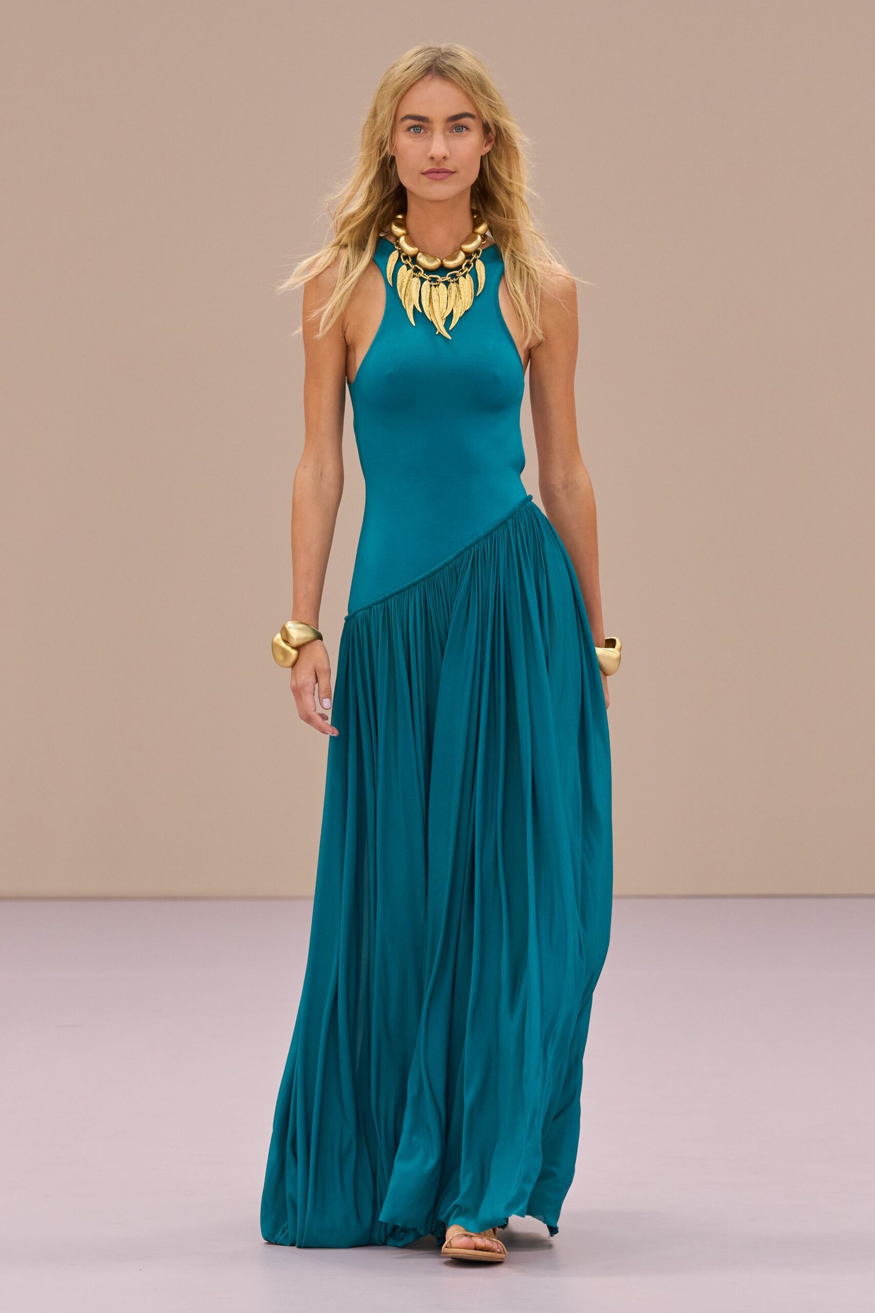 teal jersey sleeveless high-neck fitted draped flowing gown