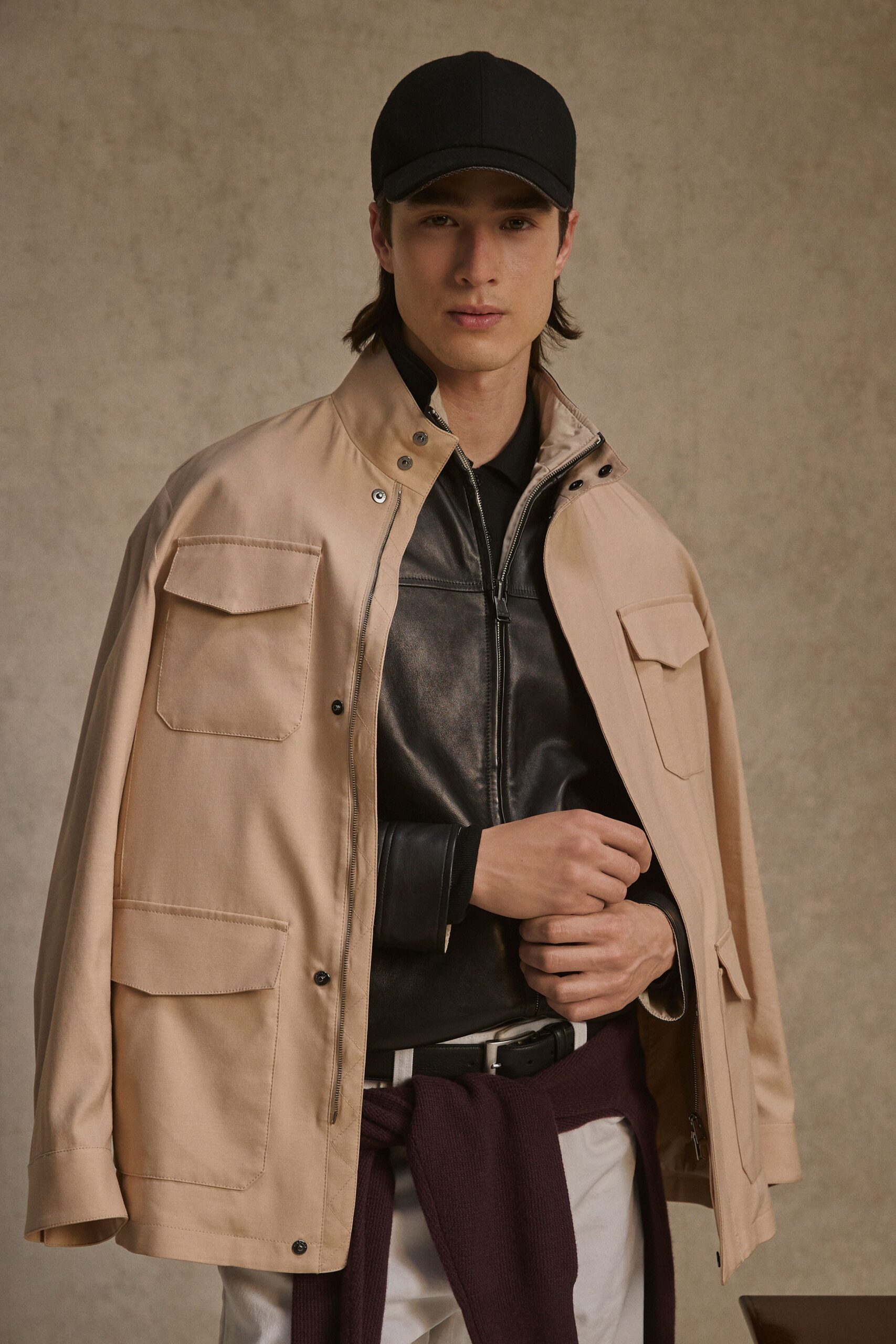 beige jacket black leather top