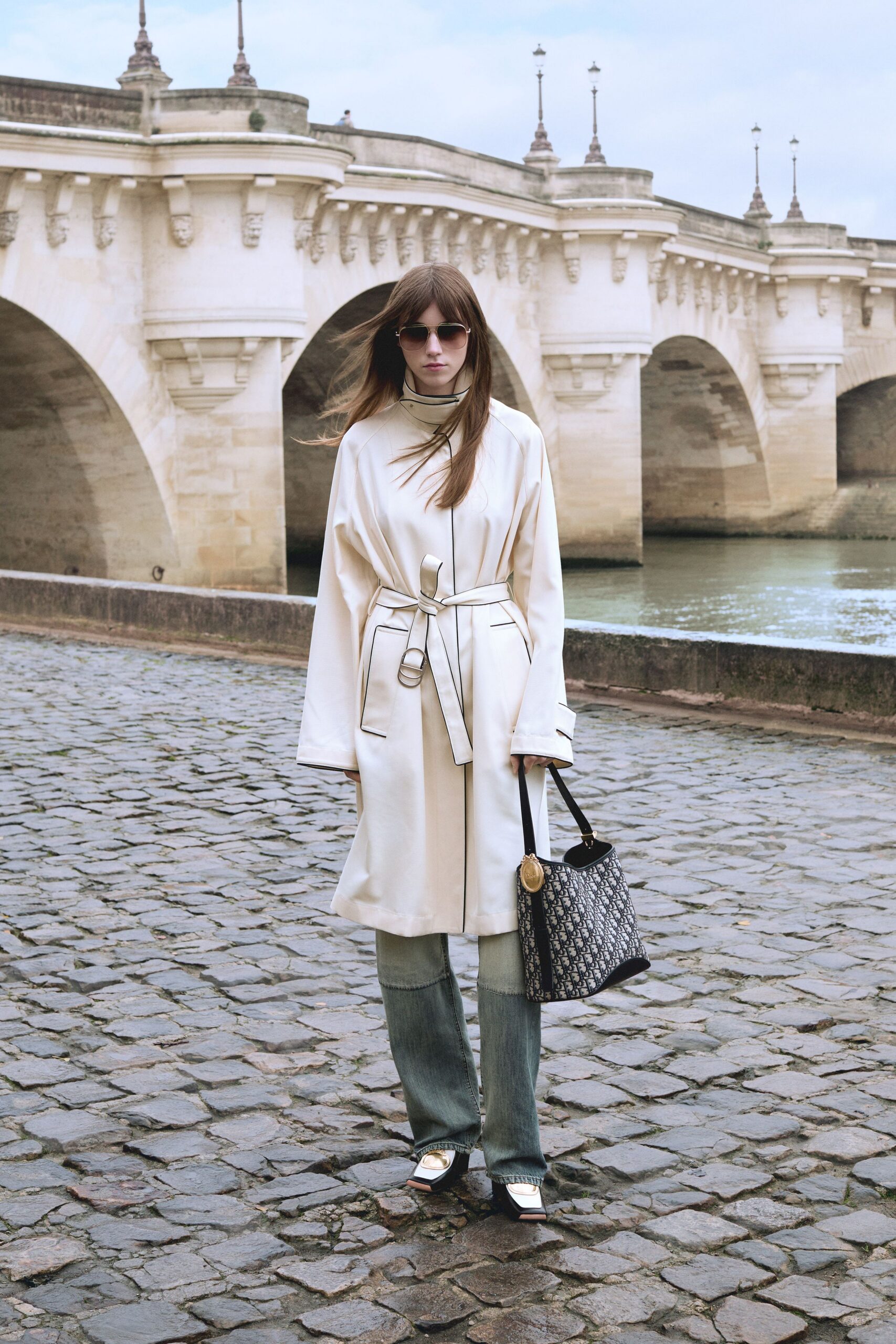 white belted coat with denim pants