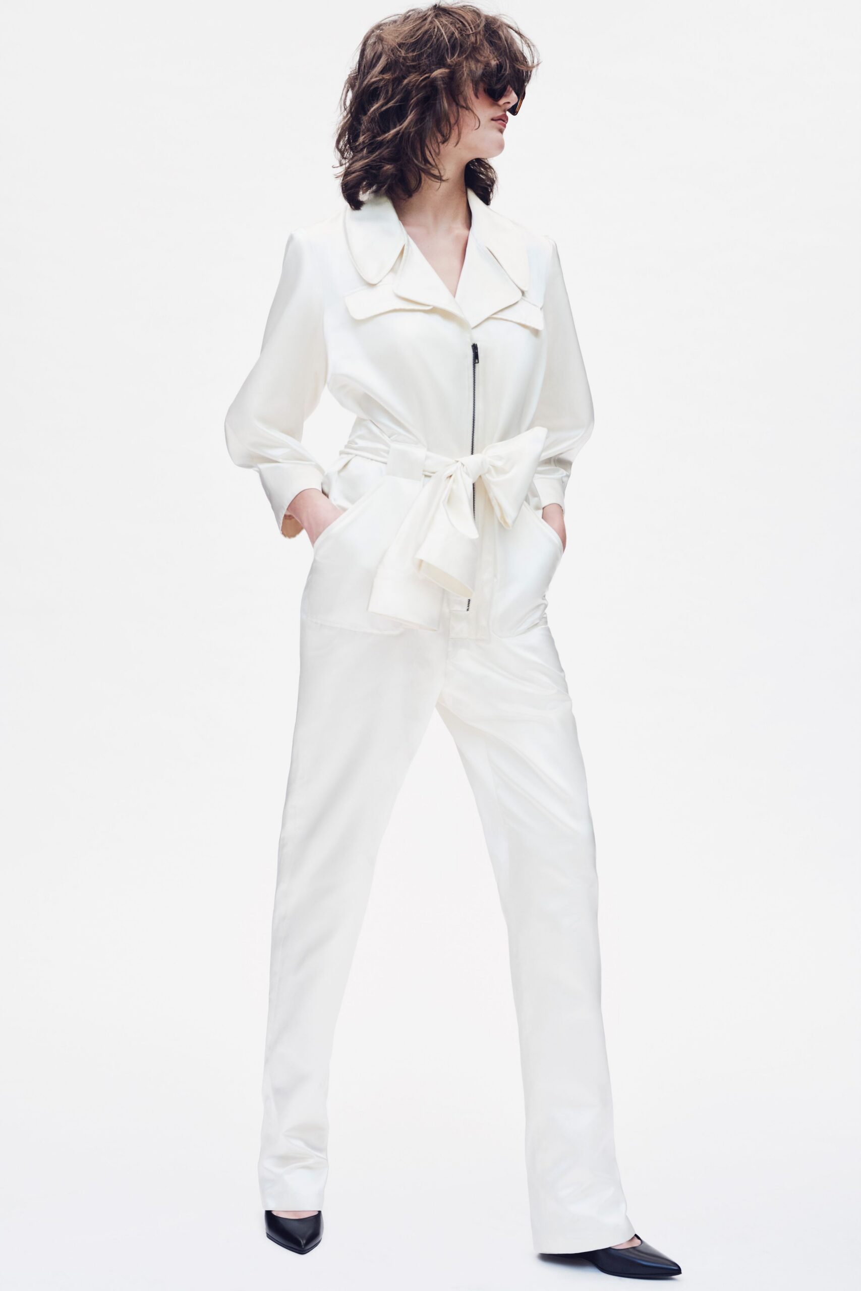 white silk long-sleeve collared fitted zippered belted jumpsuit