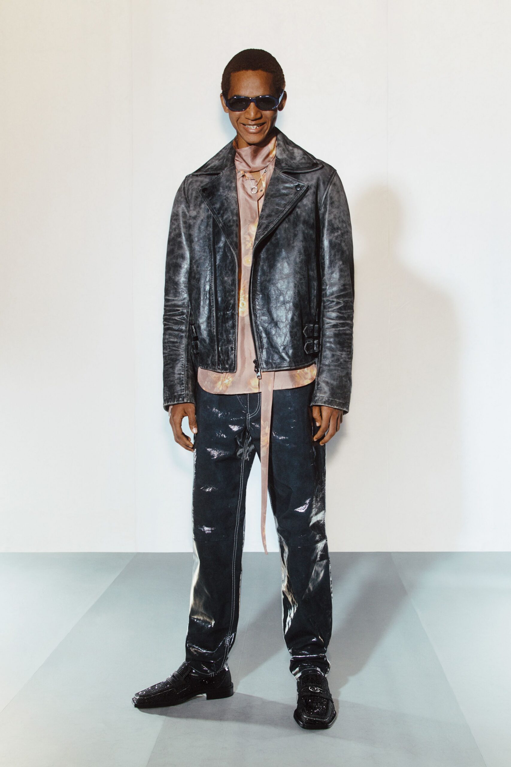 black leather jacket with pink shirt