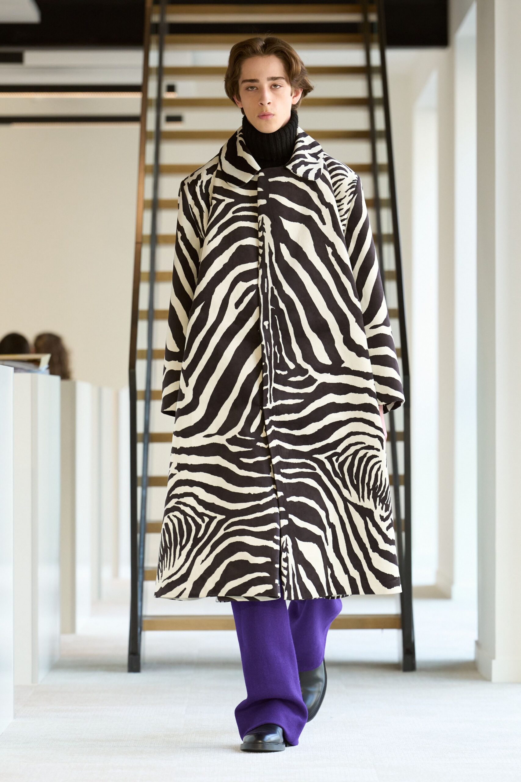 black and white printed coat with purple pants
