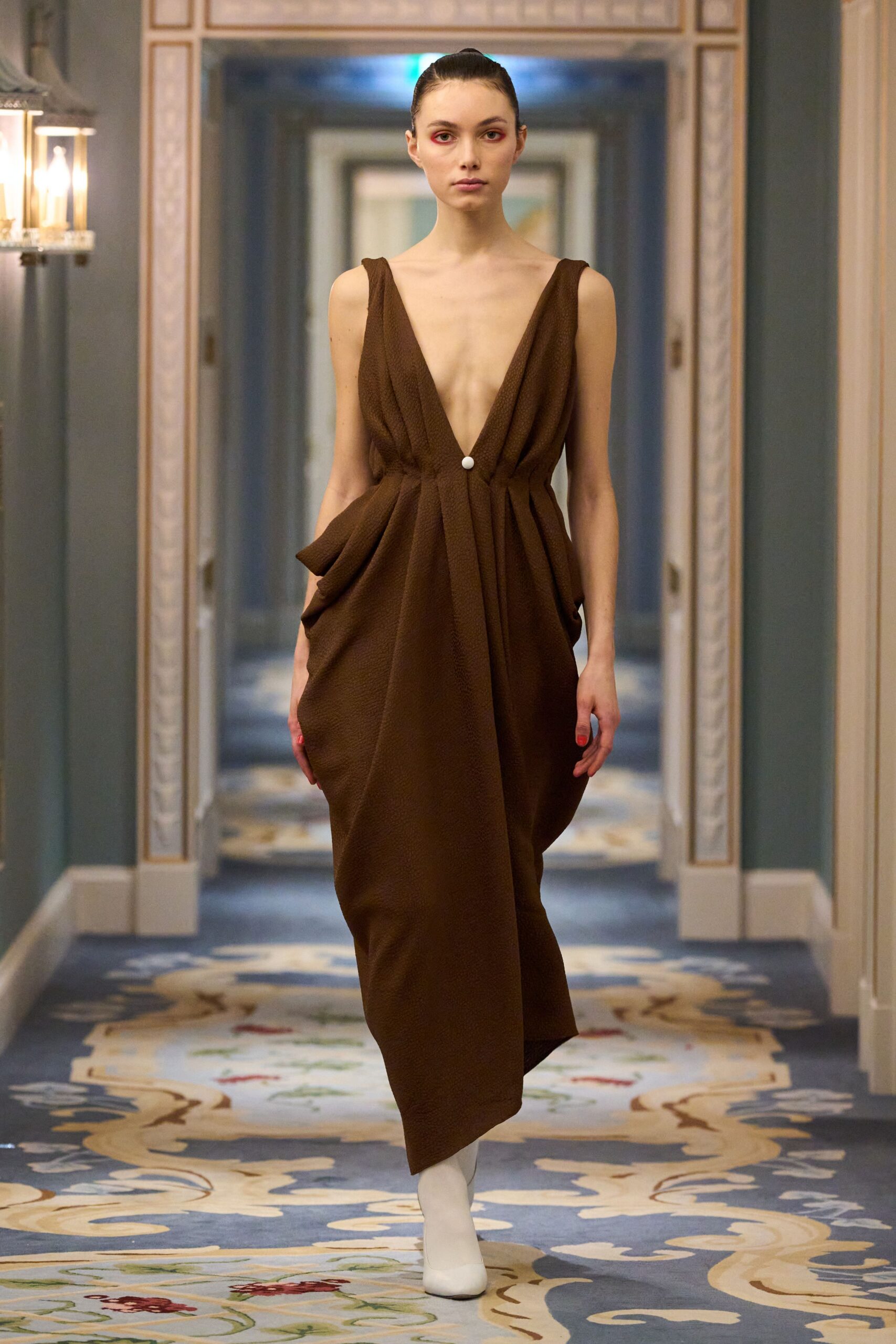 brown draped maxi dress with white boots