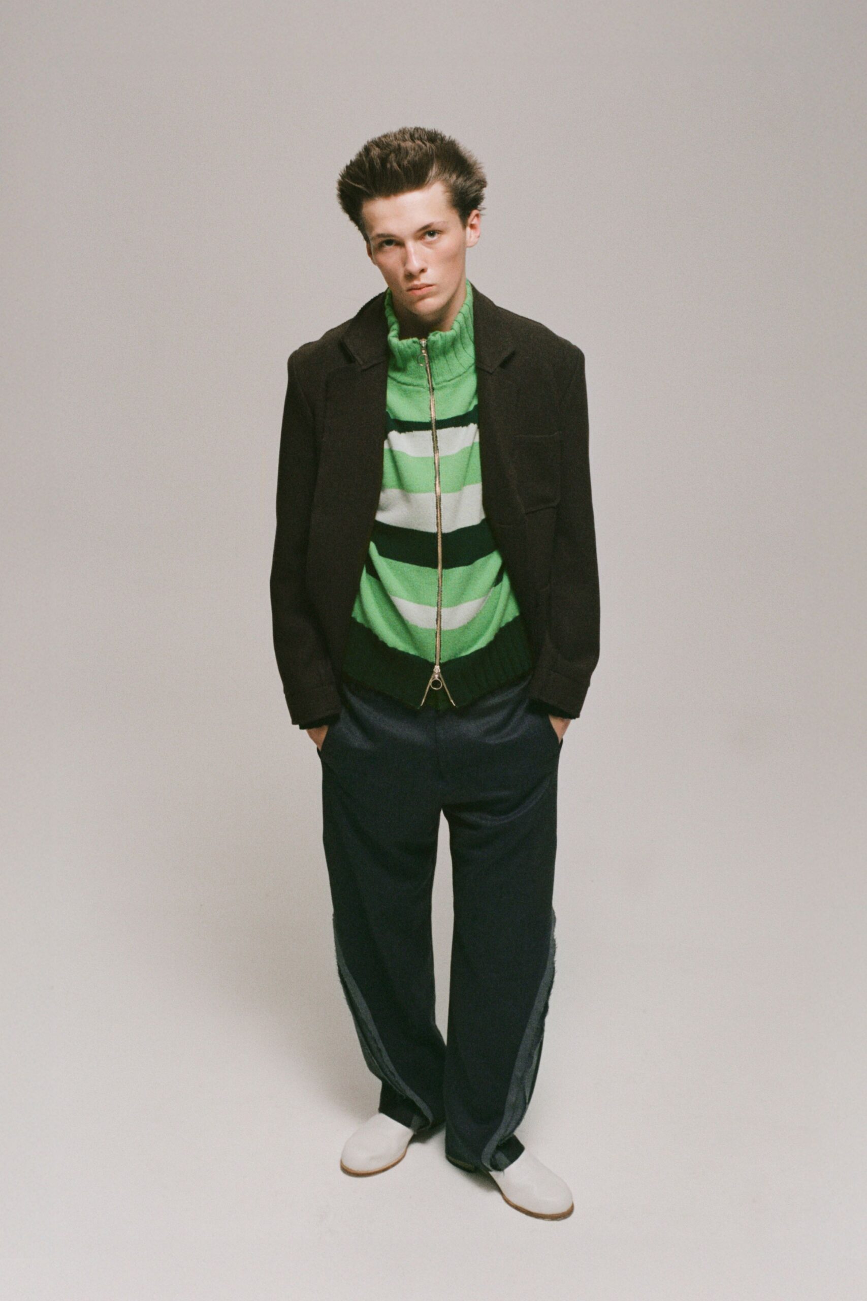 black jacket green striped top