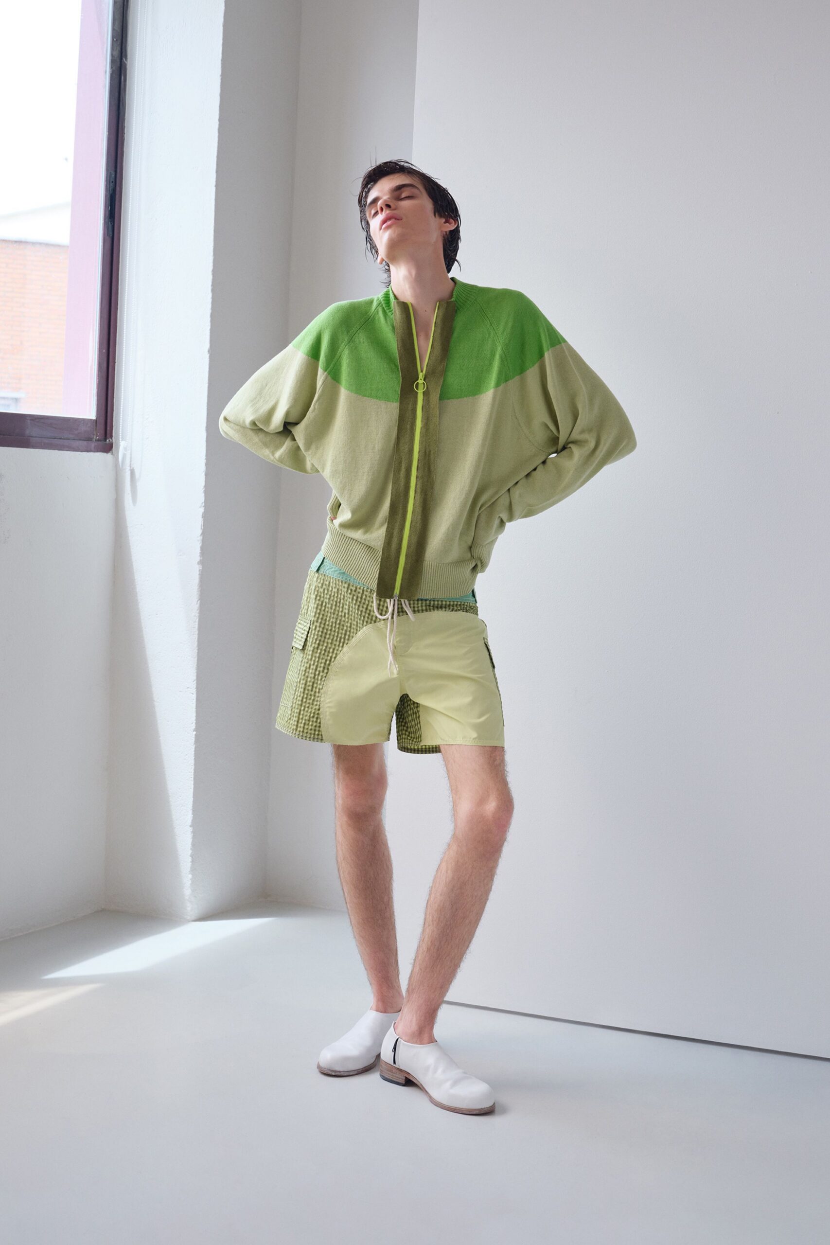 green oversized jacket with yellow shorts