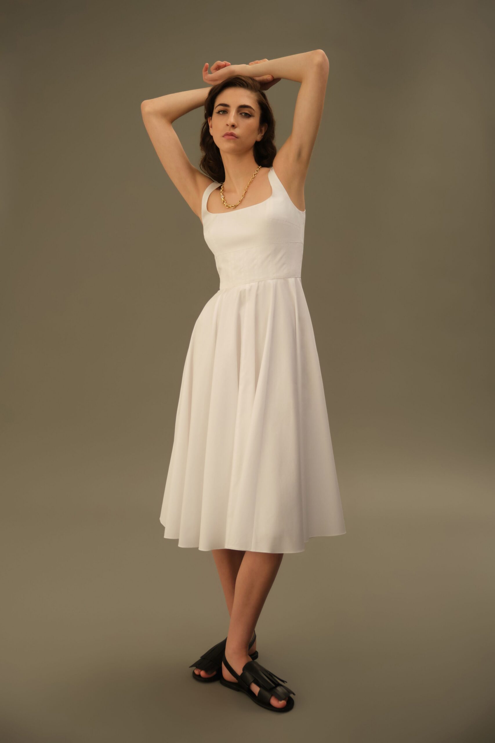 white fitted midi dress with black shoes