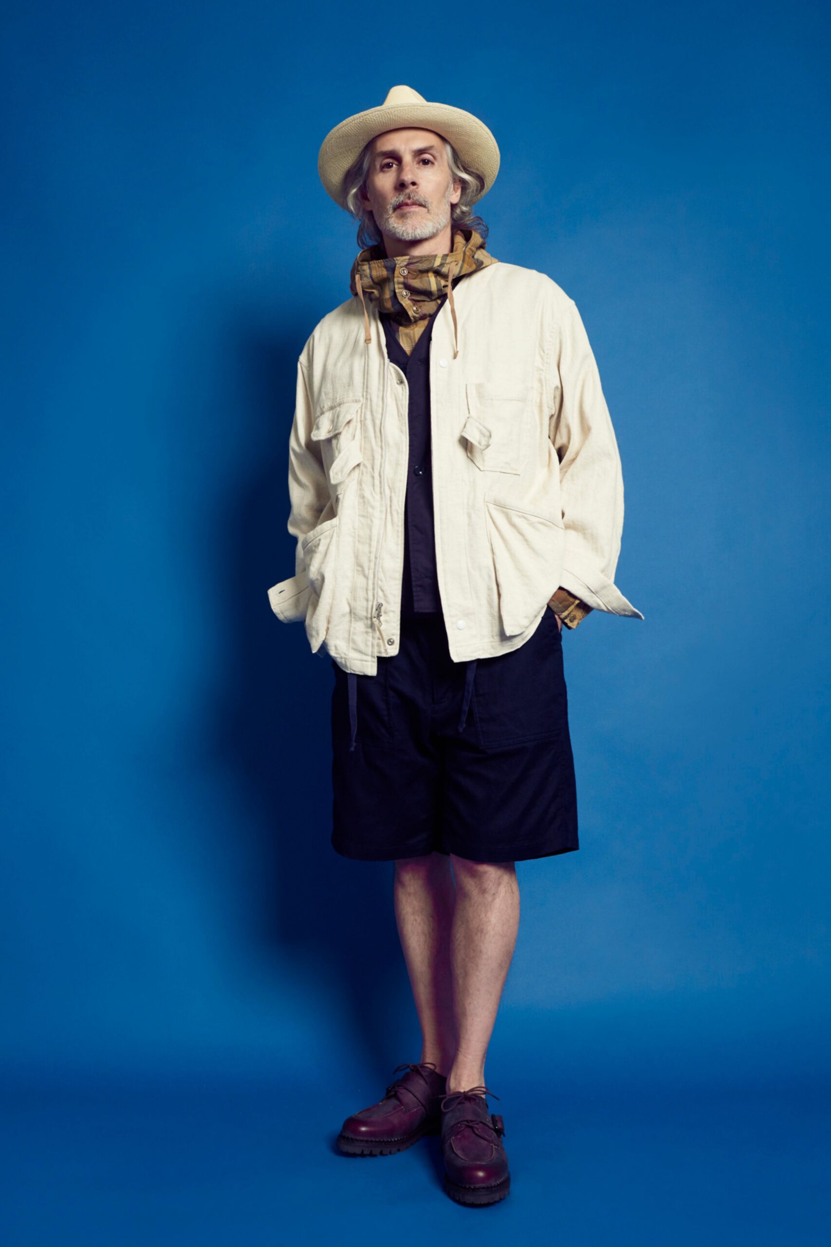 beige relaxed jacket with black shorts