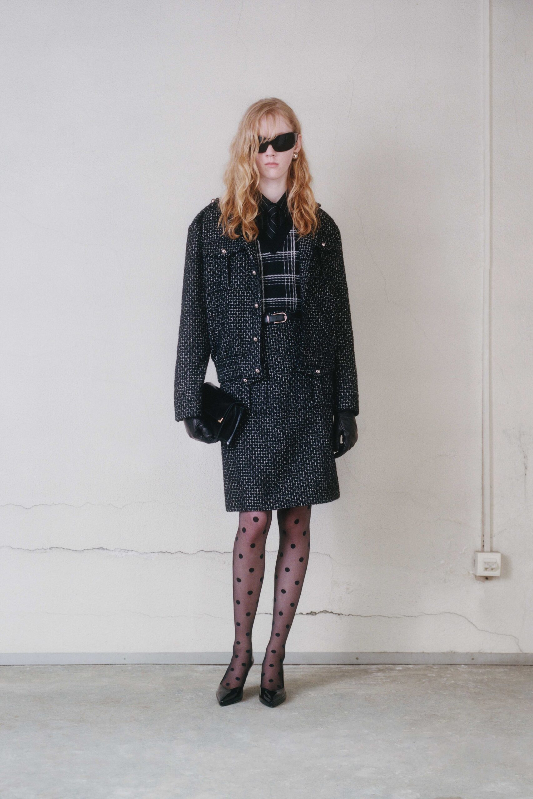 black fitted jacket and skirt ensemble