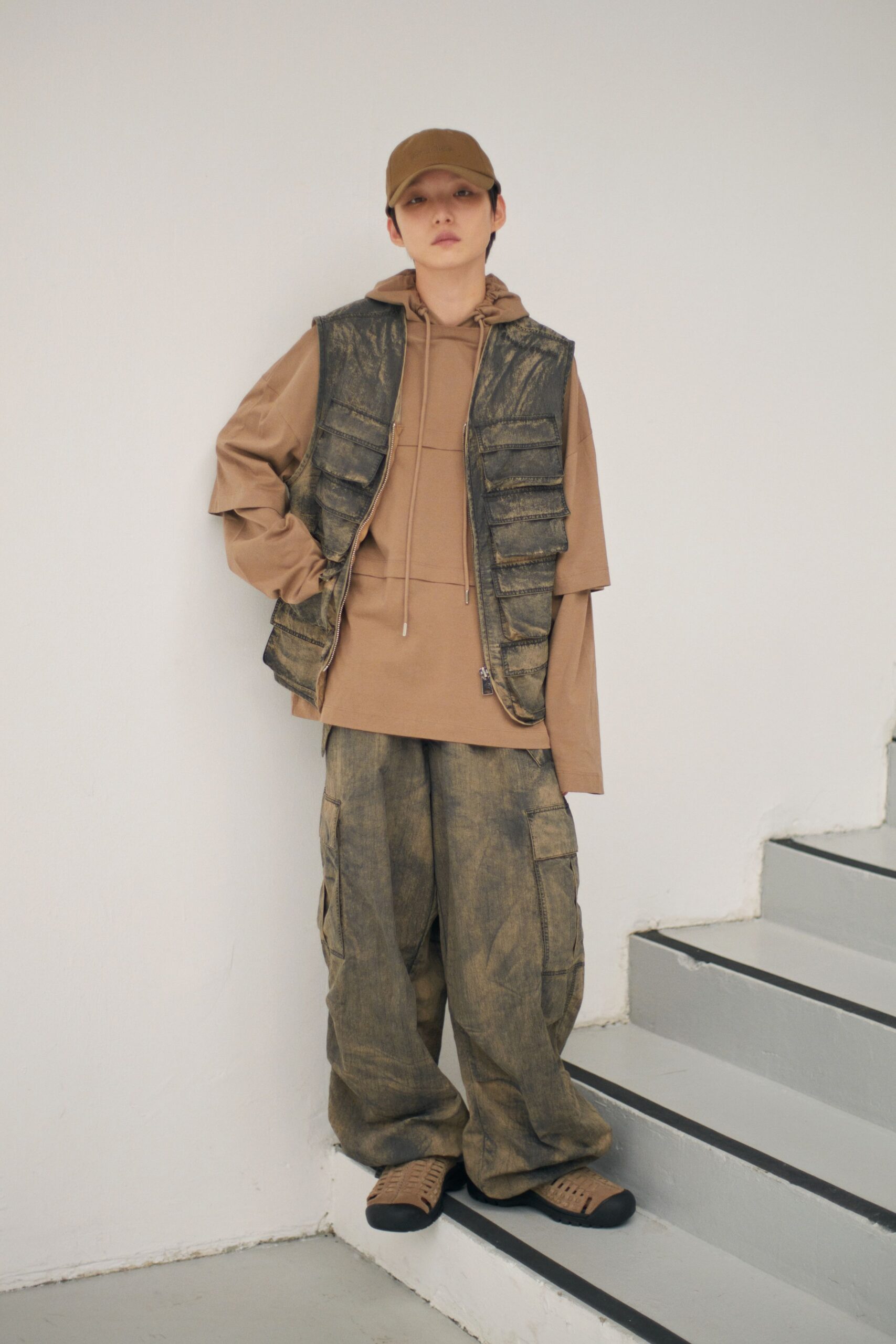 brown vest beige hoodie gray pants