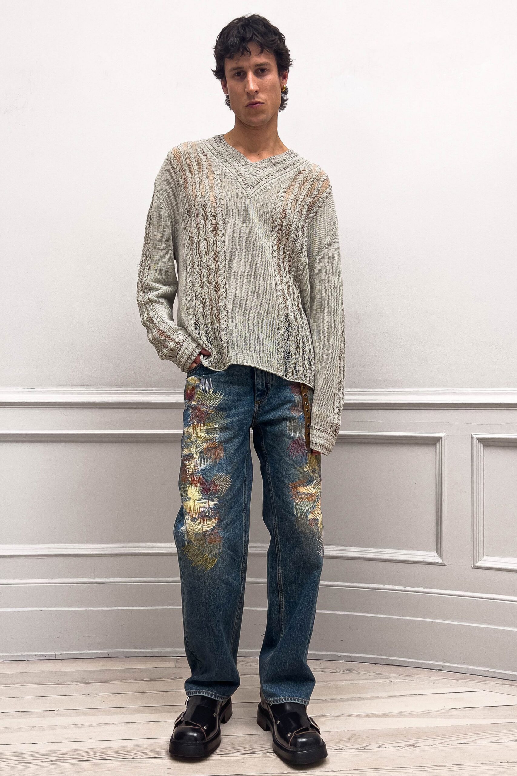 gray relaxed sweater with blue jeans