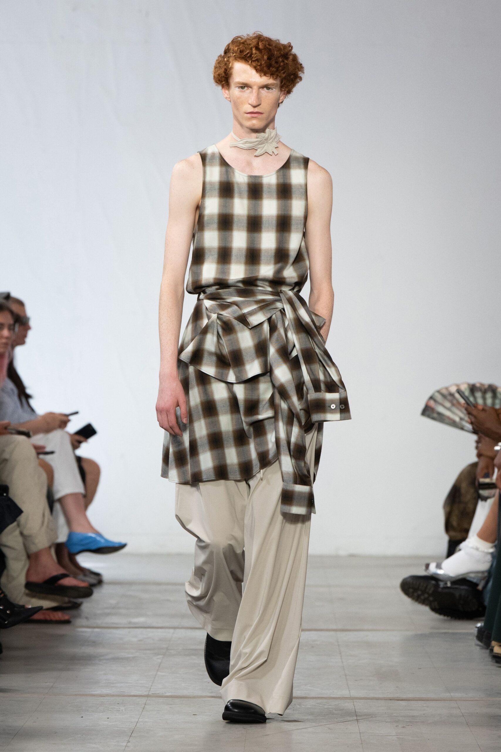 beige checked sleeveless top with relaxed pants