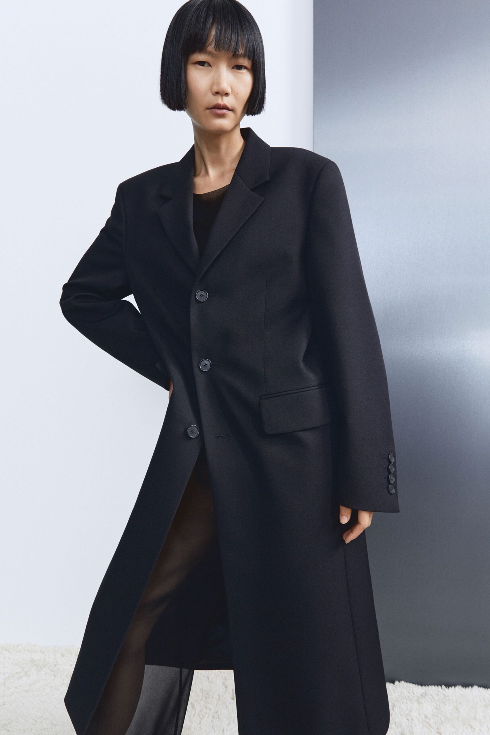 black wool long-sleeve collared structured coat