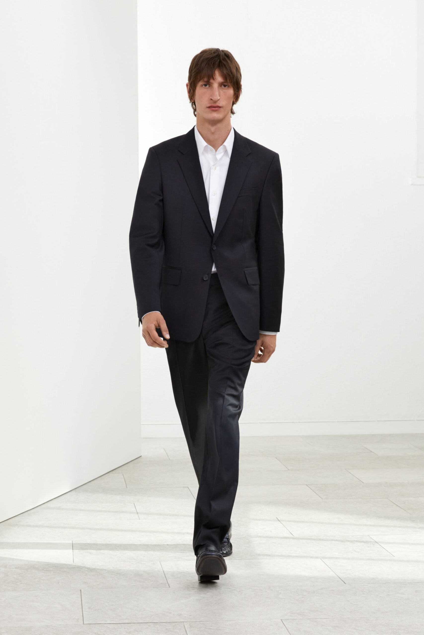 black tailored suit with white shirt