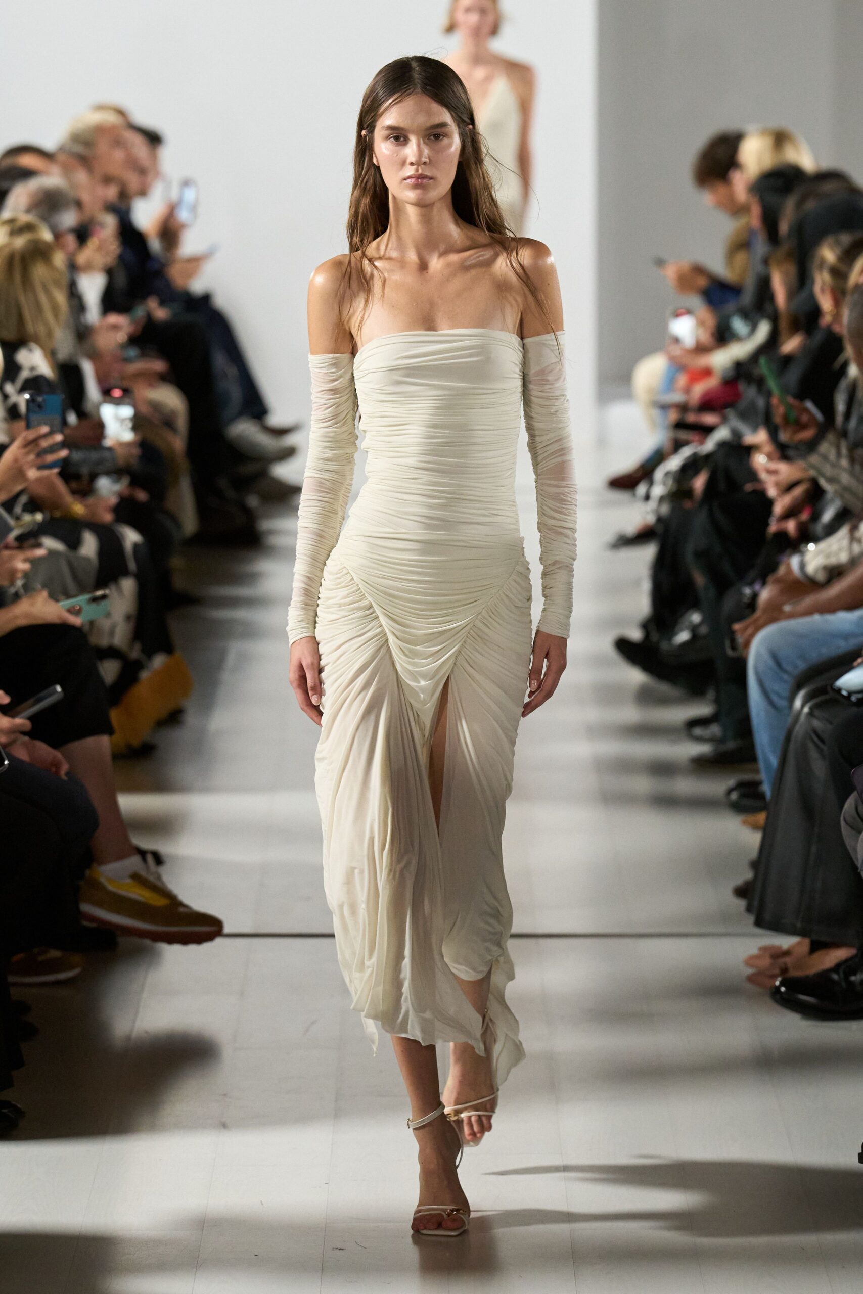 white silk sleeveless off-shoulder fitted ruched flowing gown