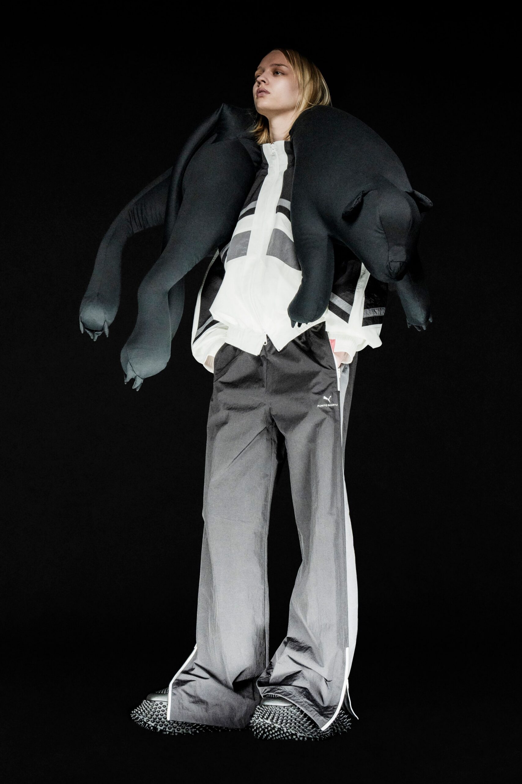 relaxed black and white jacket with gray pants