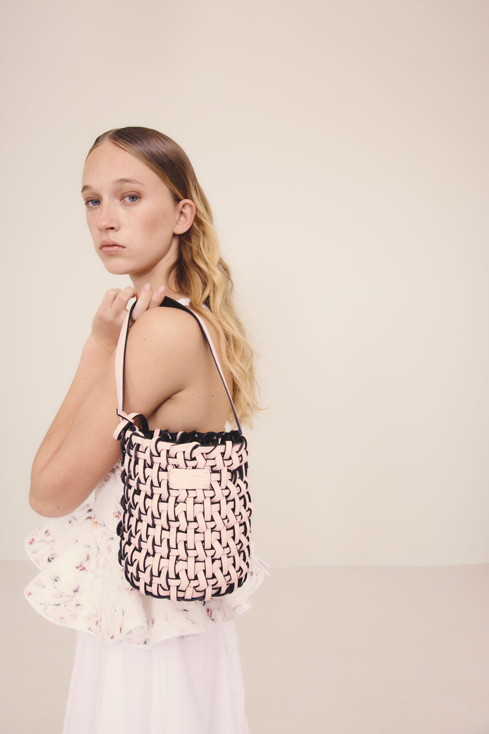 white ruffled mini dress with bag