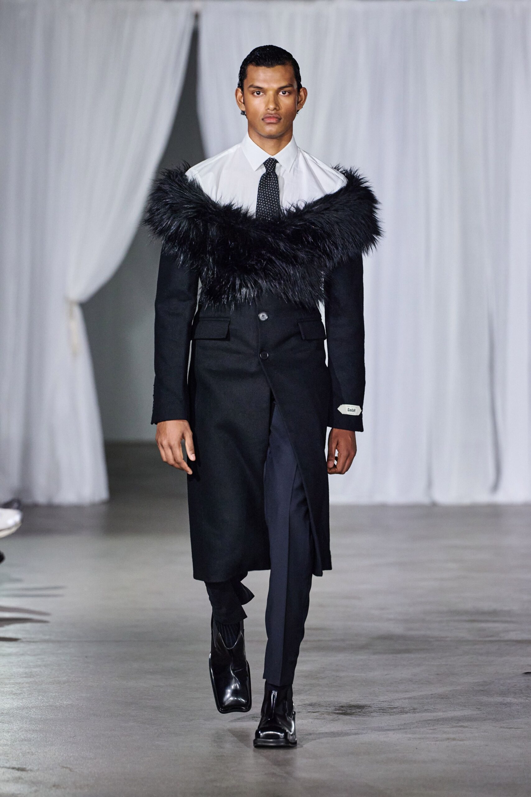 black wool long-sleeve collared fitted layered maxi coat