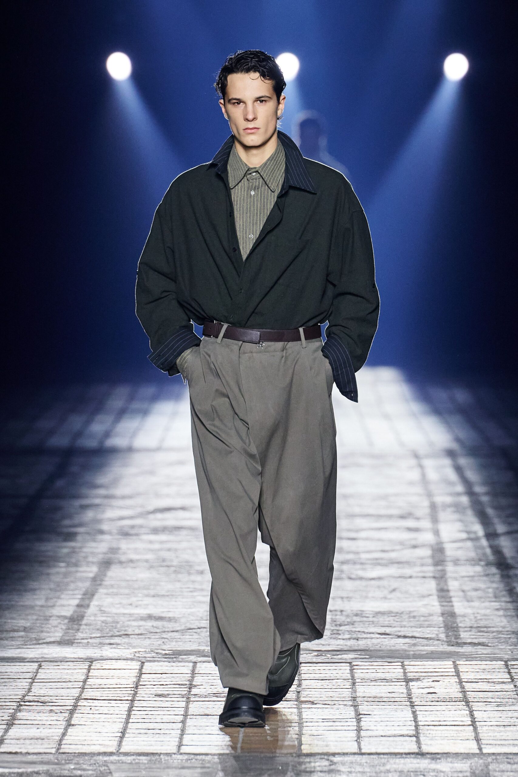 black jacket gray shirt beige pants