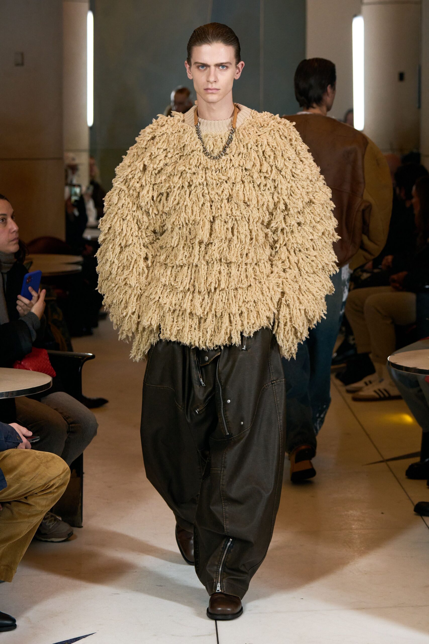 beige oversized fringed sweater with brown pants