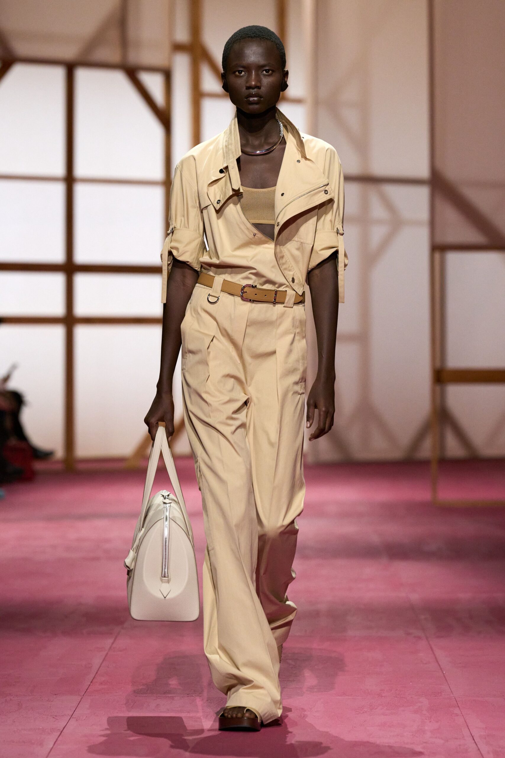 beige fitted jumpsuit with bag