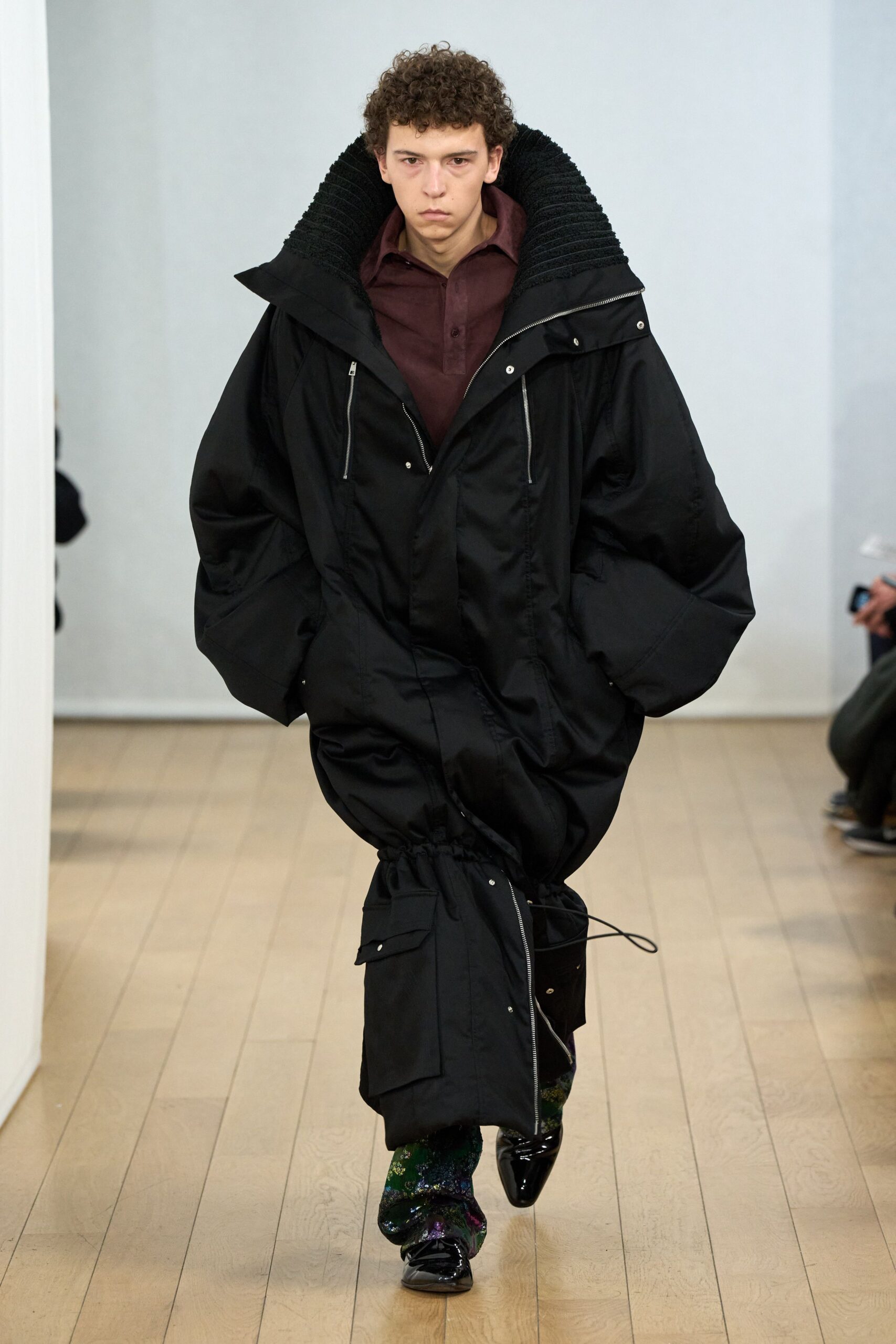 oversized black coat with maroon shirt