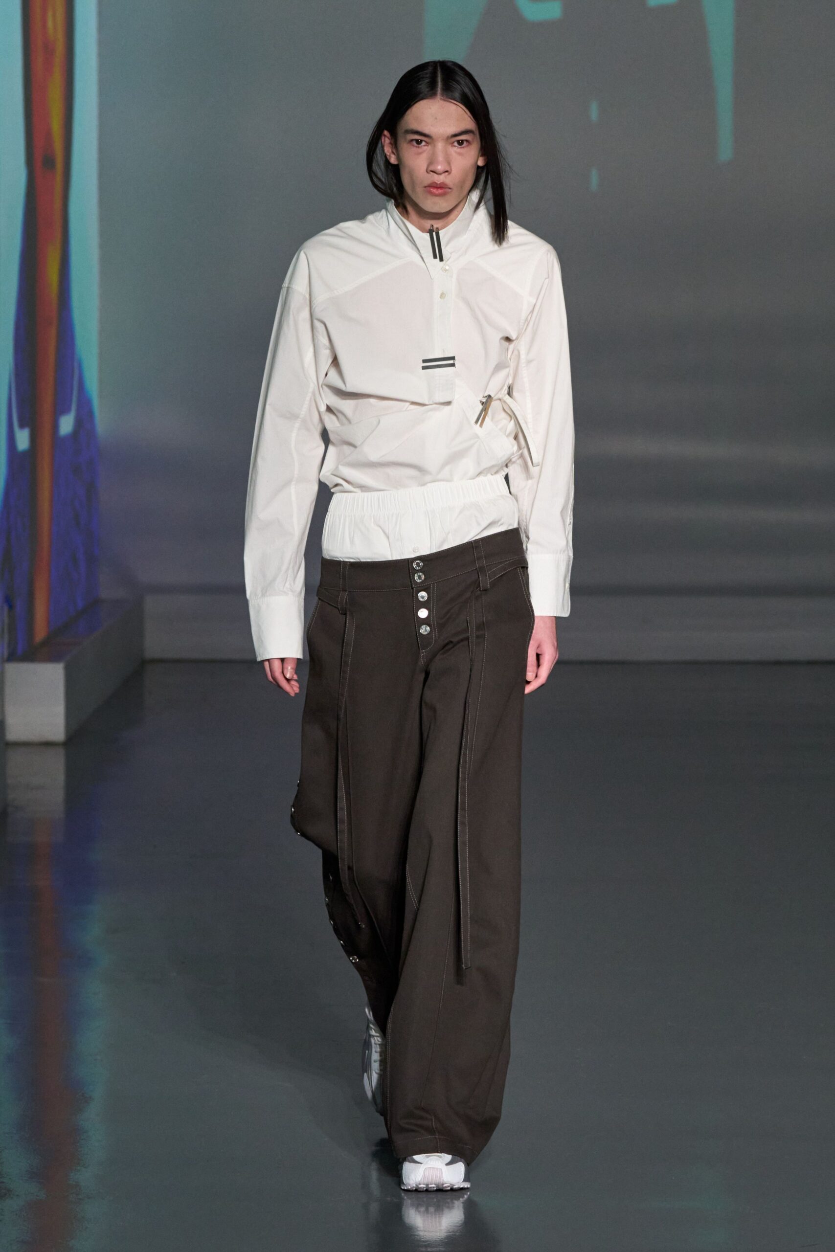 white fitted jacket with brown relaxed pants