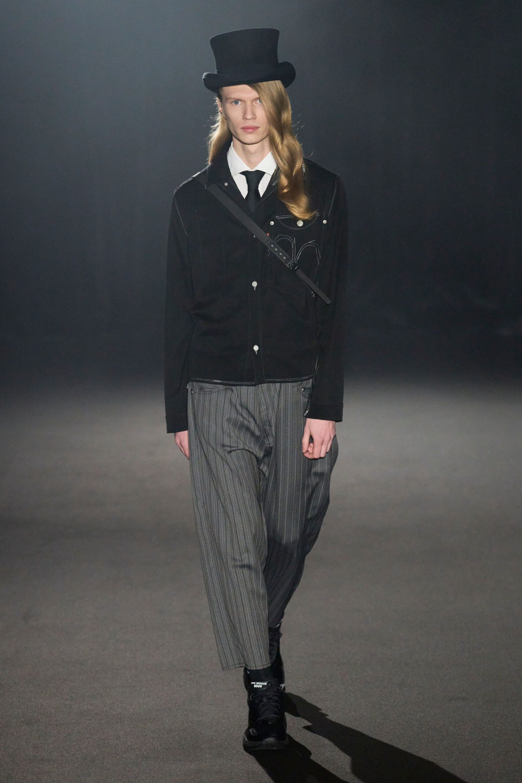 black jacket gray striped pants