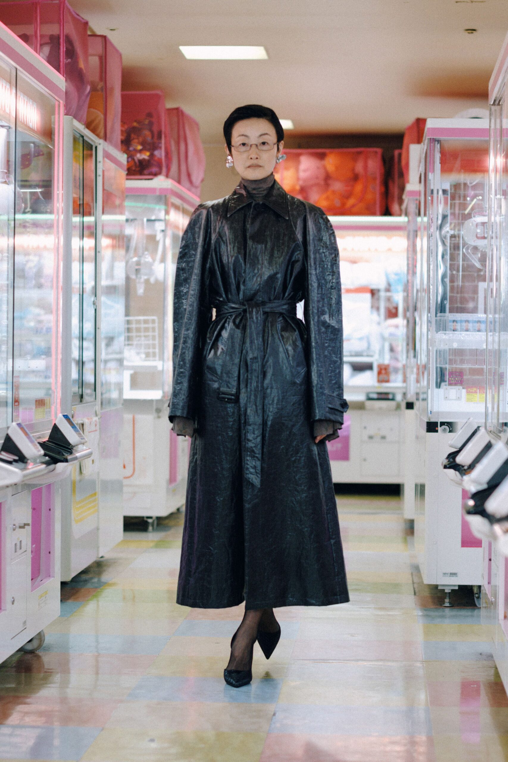 black leather long-sleeve collared fitted belted a-line coat