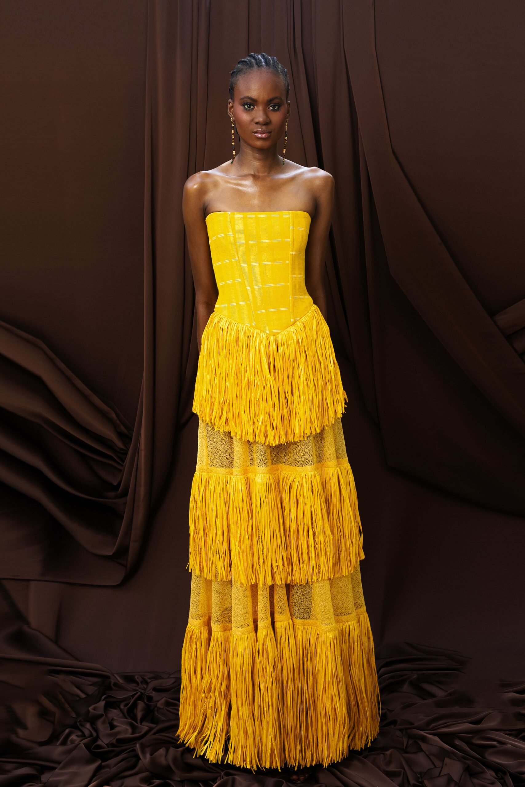 yellow strapless fringed gown