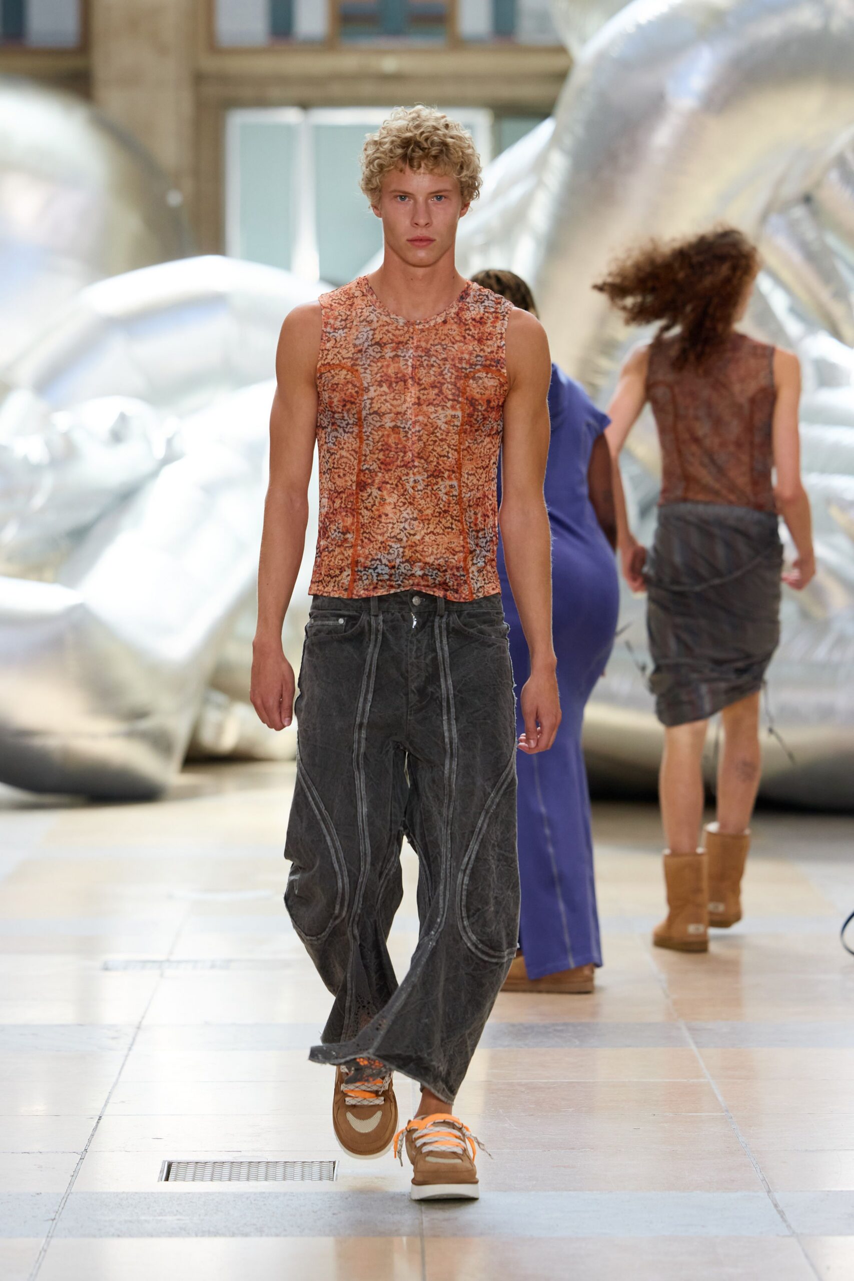 orange printed tank-top with gray pants