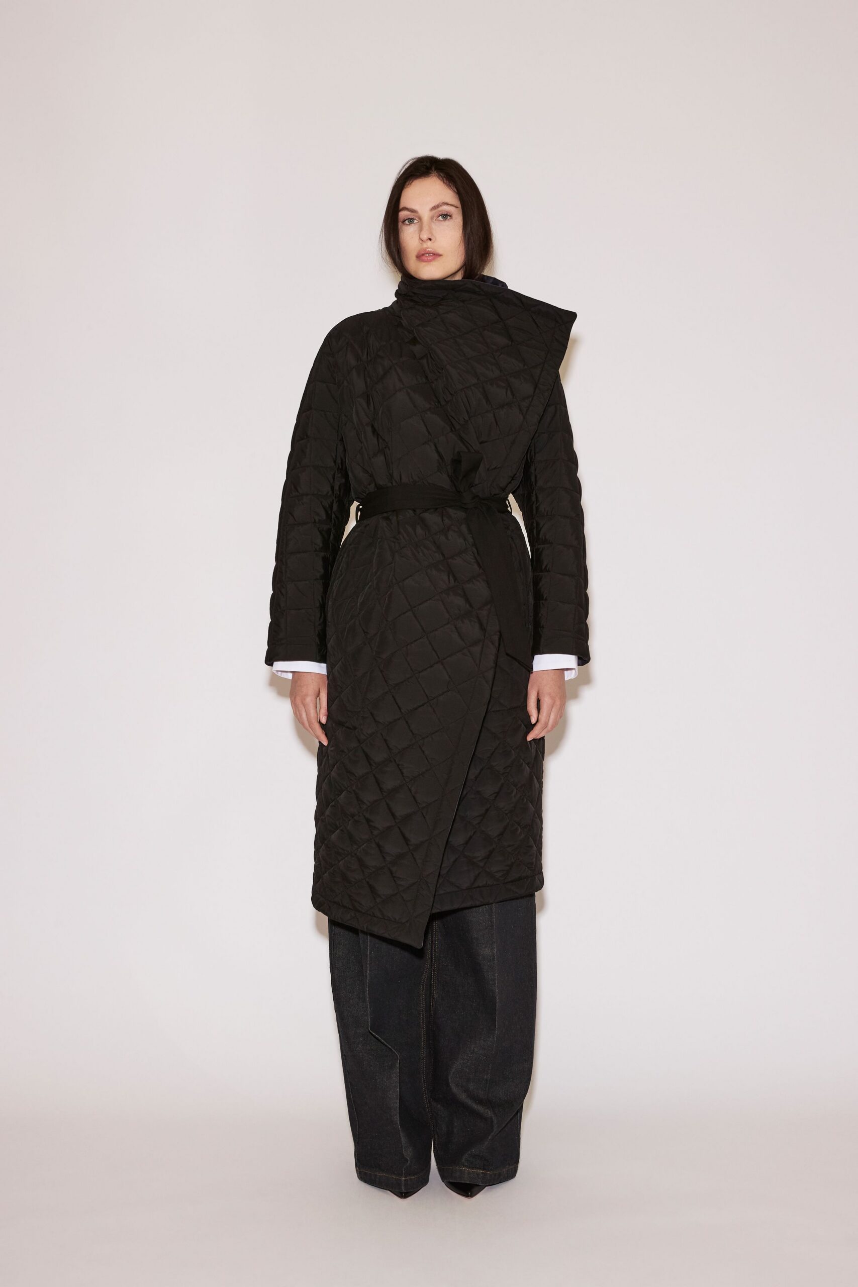 black quilted coat with denim pants