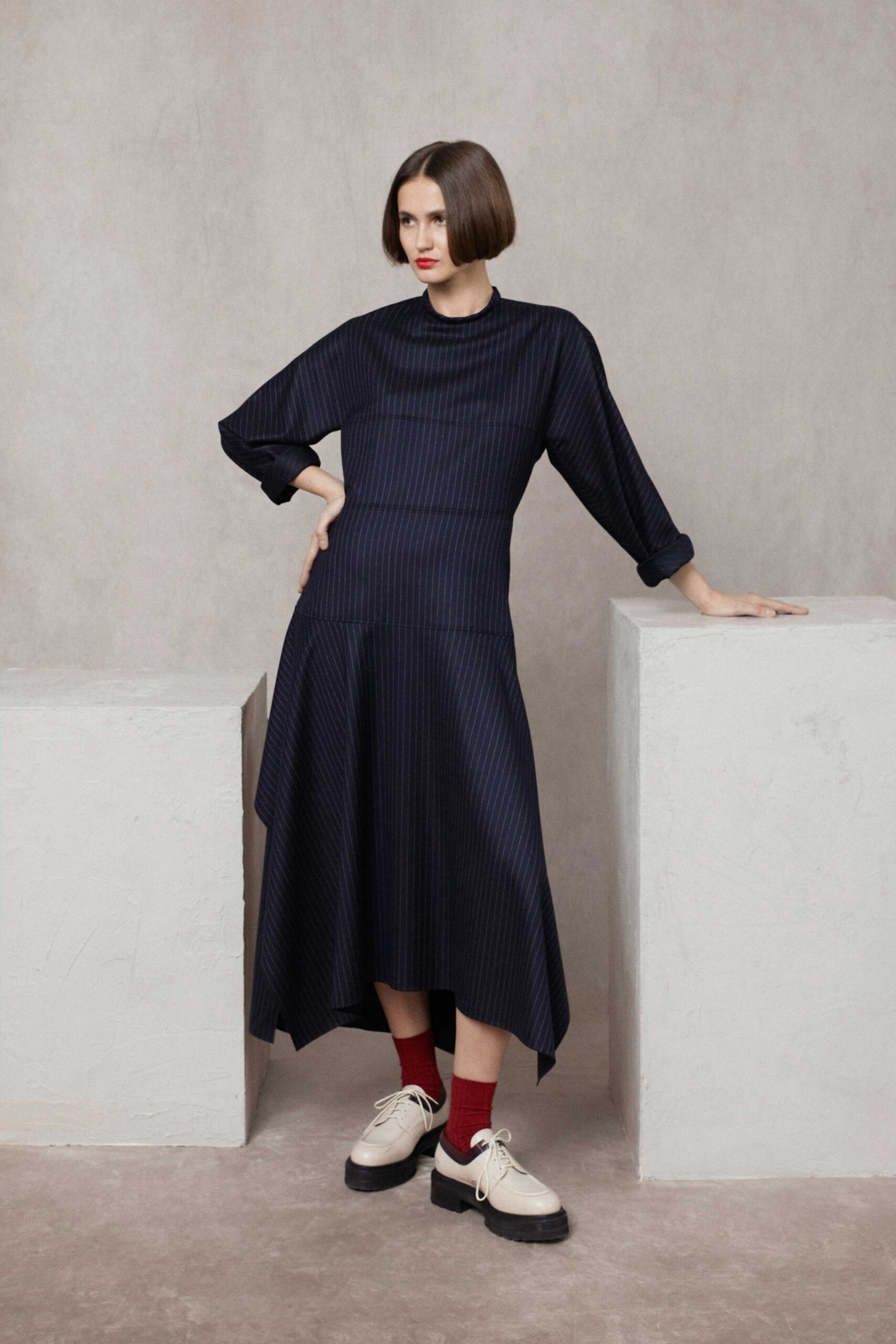 black pleated midi dress with white shoes