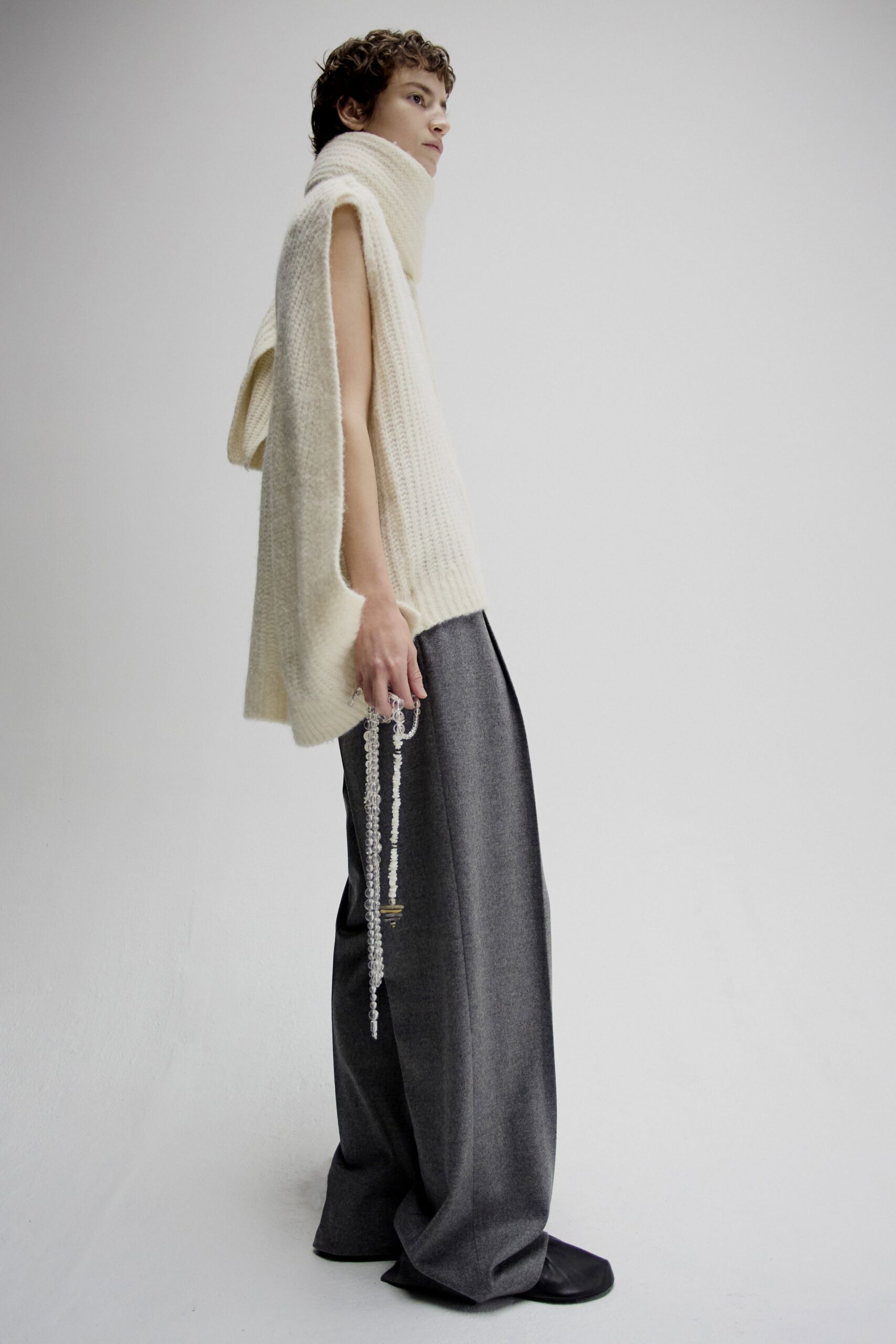 white wool sleeveless high-neck relaxed layered top