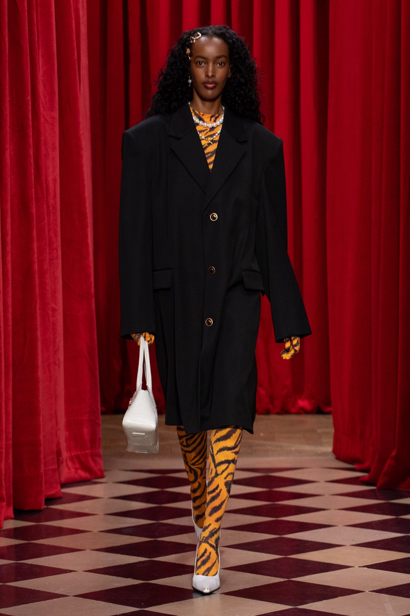 oversized black coat with animal-print top and pants
