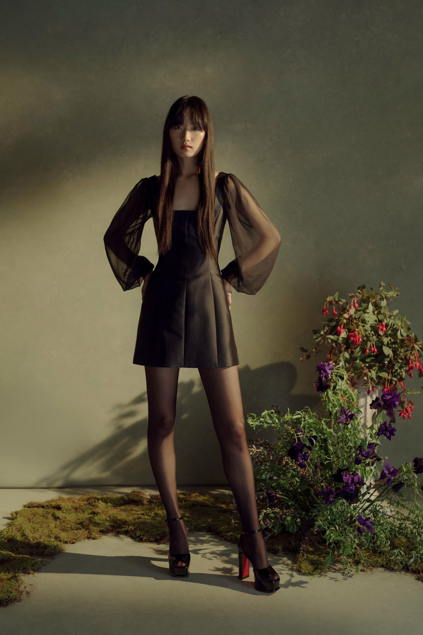 black leather mini-dress with long sleeves